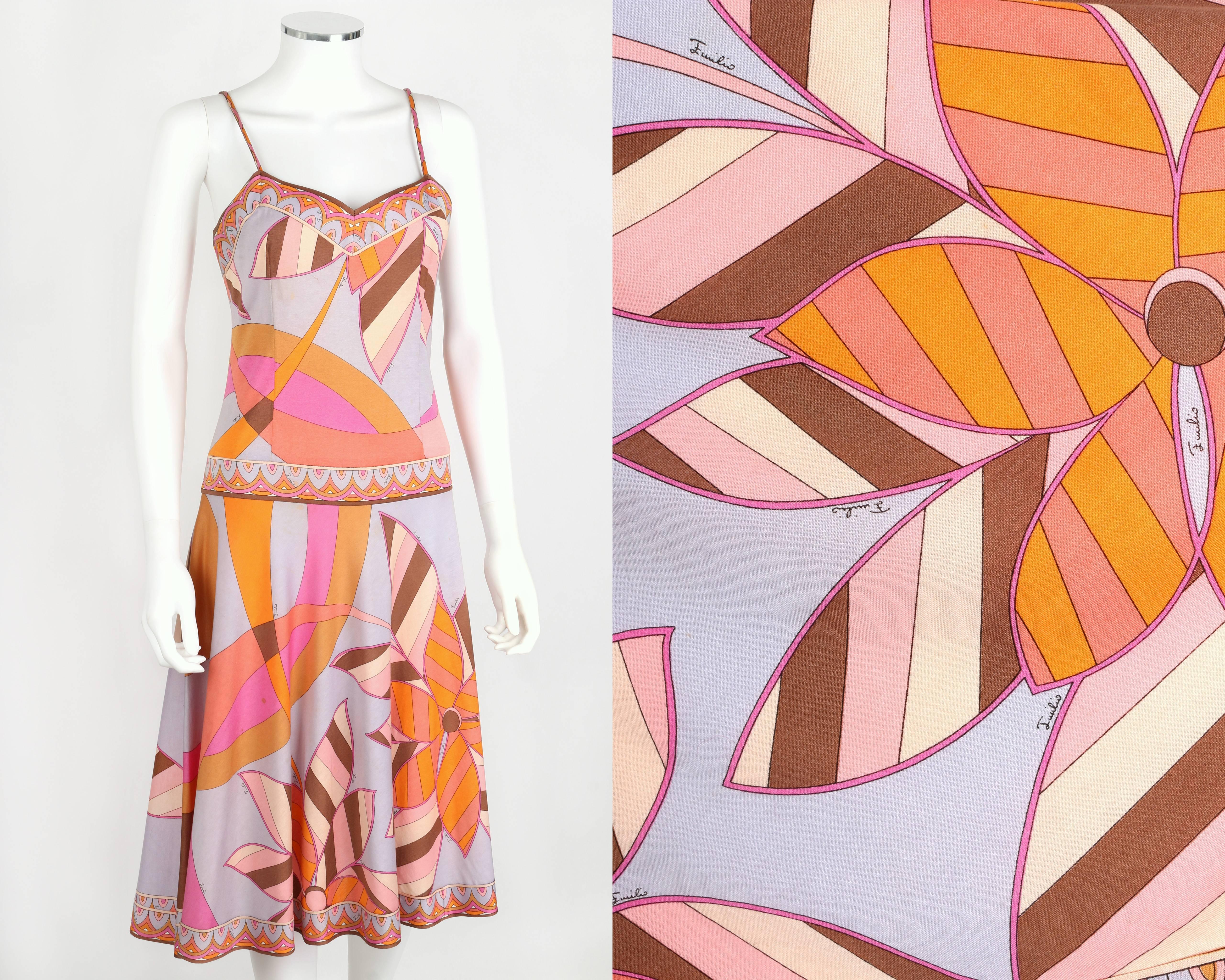 Vintage c.1970s Emilio Pucci cotton jersey drop waist sundress. All over multicolor abstract floral signature print motif. Decorative border on neckline, waist, and hem. Spaghetti straps. Knee length. Full skirt. Zips at side. Marked Fabric Content: