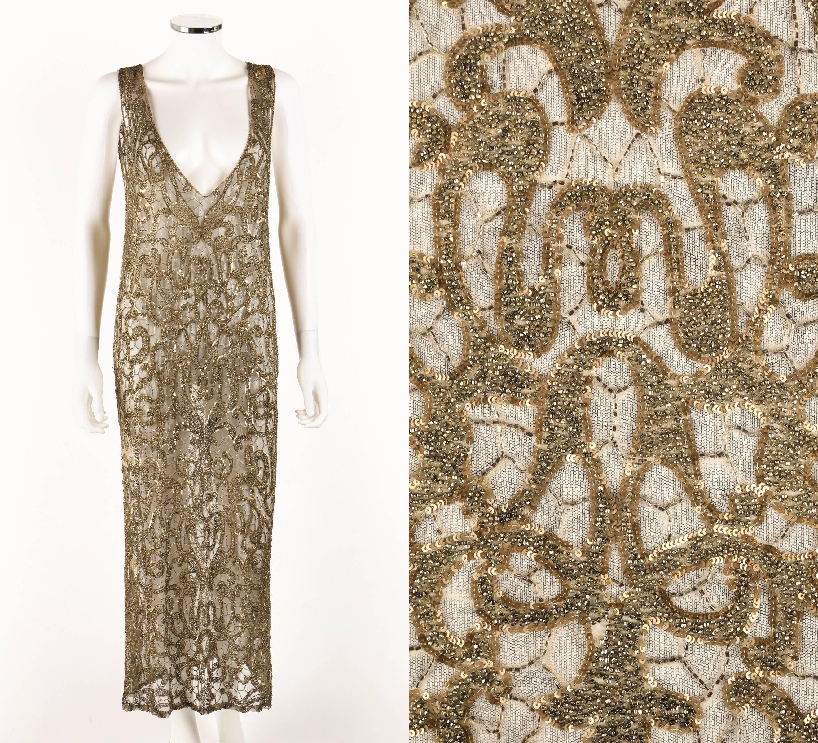 Couture (one of a kind) 1920's gold (with greying hues - offering a rich platinum / gold look) sequin beaded net evening dress. Elegant art deco bead and sequin pattern. Sleeveless. Plunging front and back neckline. Side seam slits. Slip on.