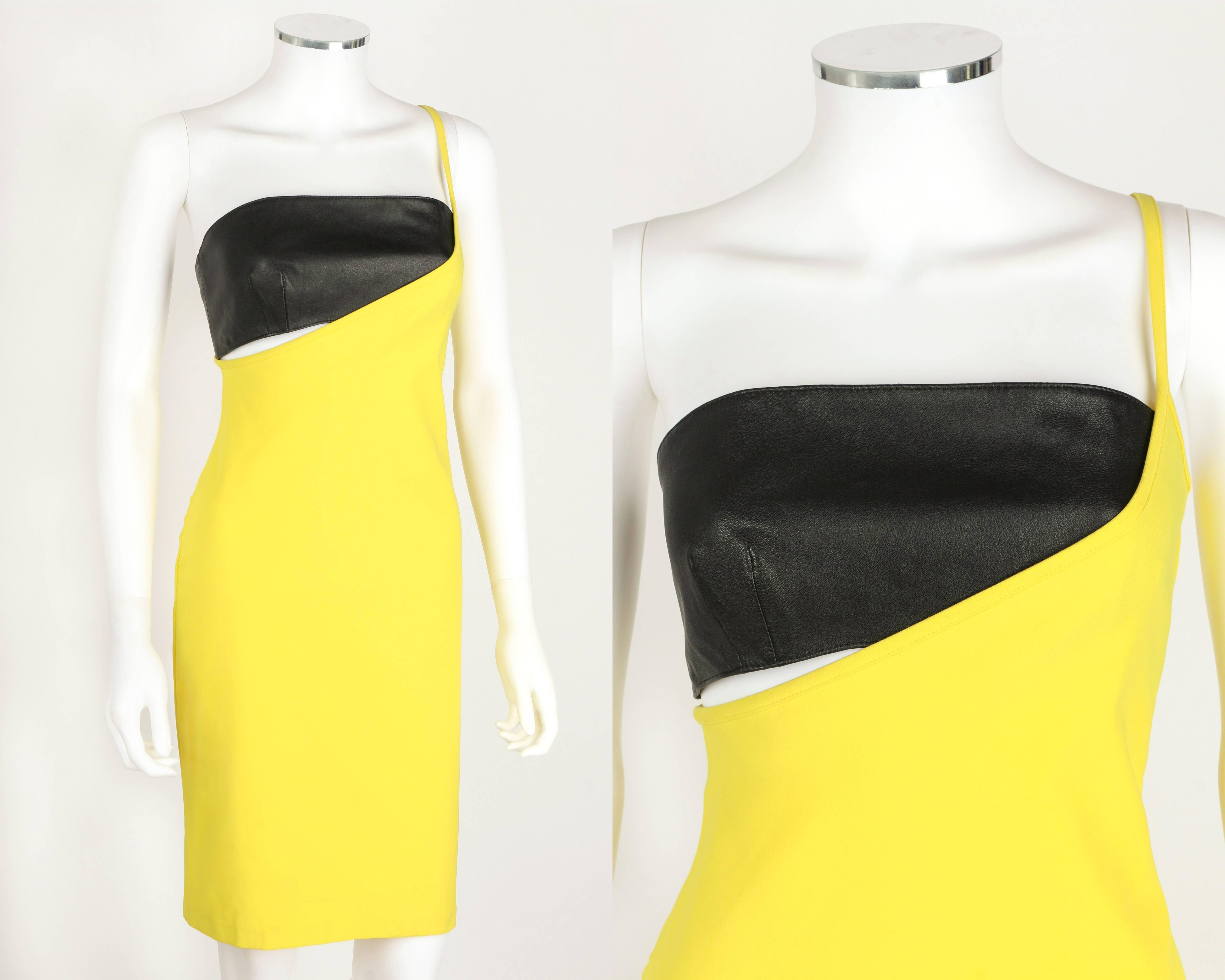 Versus Gianni Versace c.1990's yellow bodycon dress and leather bandeau top set. Single left side spaghetti strap. Pullover style. Black genuine leather bandeau top is fully lined and zips at left side. Knee length. Original tags attached. Please