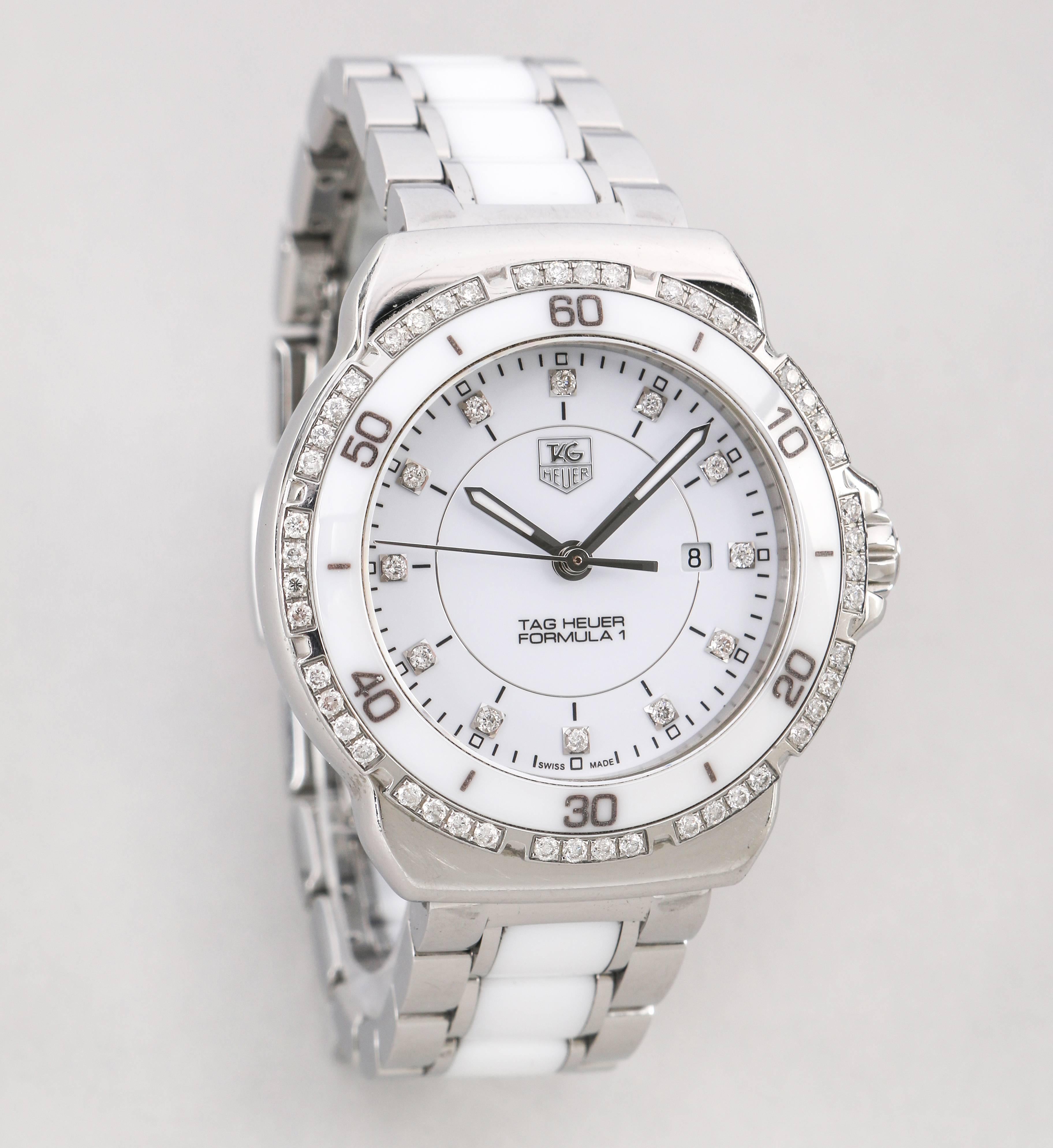 Authentic Swiss made Tag Heuer Ladies Formula 1 White Dial Diamond Stainless steel Ceramic Chronograph Watch. Bezel is stainless steel and ceramic encrusted with diamonds. Diamond indexes illuminate each hour. 60 diamonds total. Case is stainless
