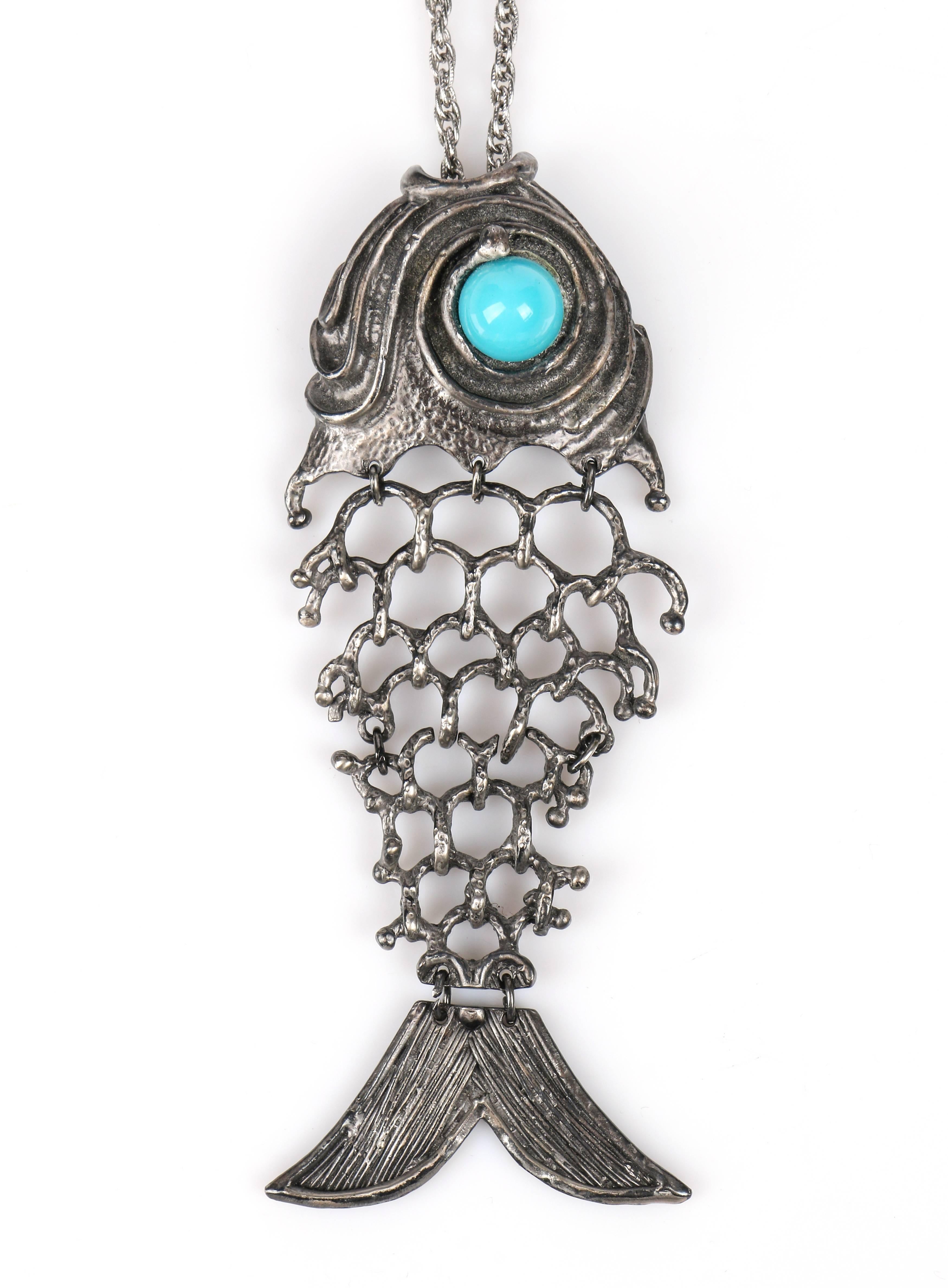 Vintage c.1970's Erwin Pearl silver tone/pewter tone statement fish pendant with turquoise stone necklace. Fish pendant has a large body section of articulated open work metal with carved tail and head detail (measuring approximately 6