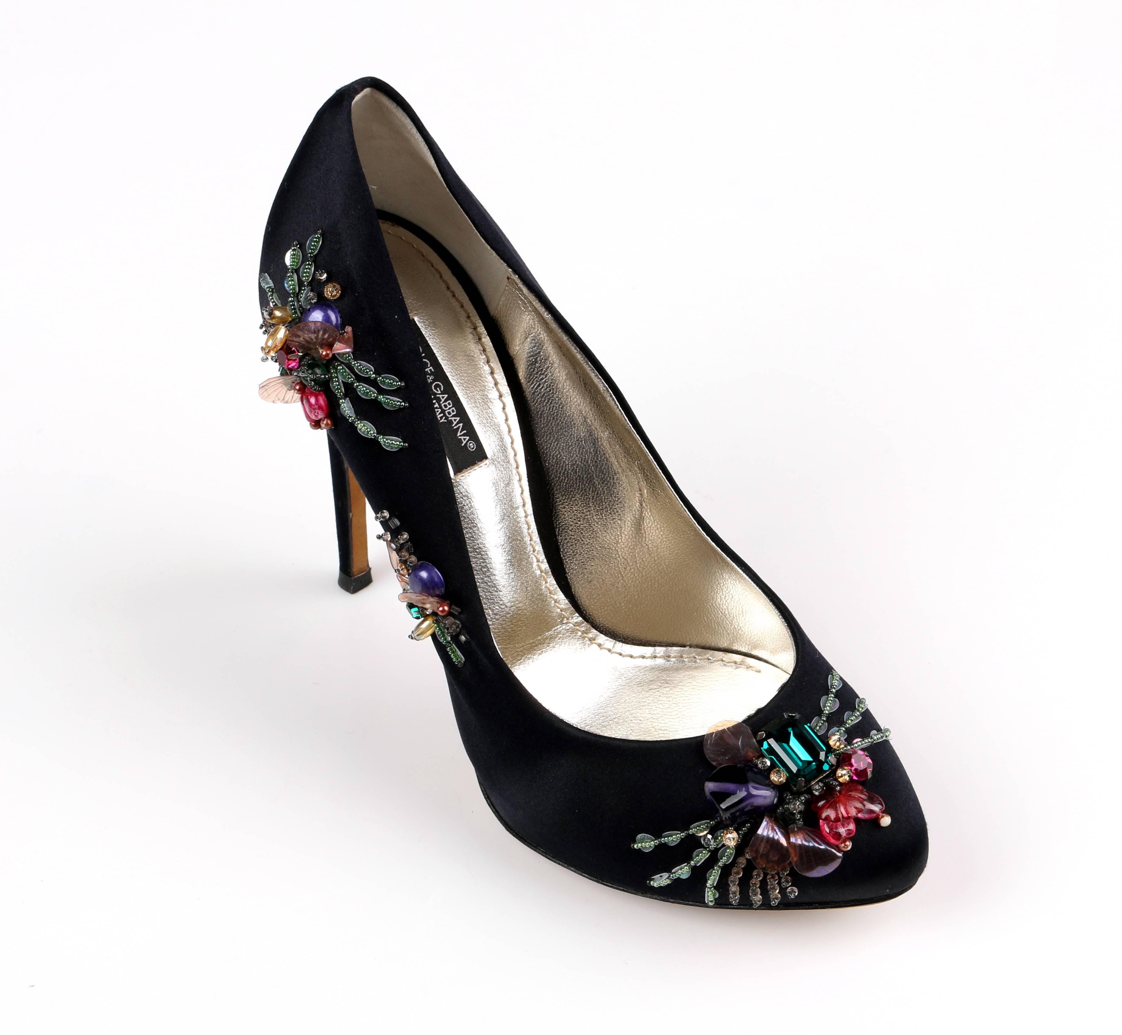 Dolce & Gabbana black satin platform high heel pumps. Upper is embellished with multicolored beads and jewels. Hidden platform. Almond toe. Black satin covered high heel. Marked Material: Sole is marked 