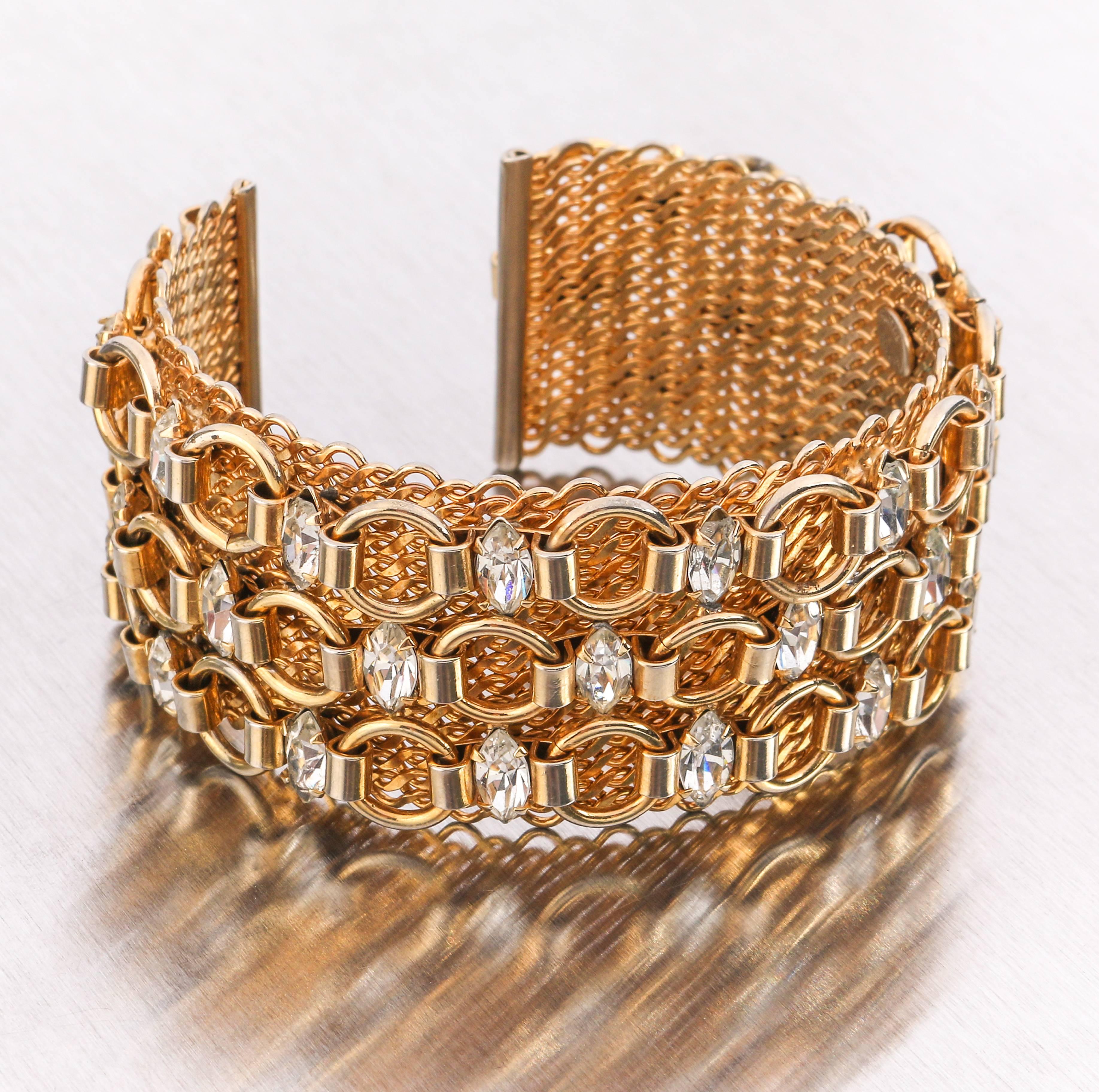 Vintage c.1960's Hattie Carnegie gold tone mesh and chain link cuff bracelet with marquise cut crystal colored rhinestones. Wide mesh cuff measures approximately 1 1/4
