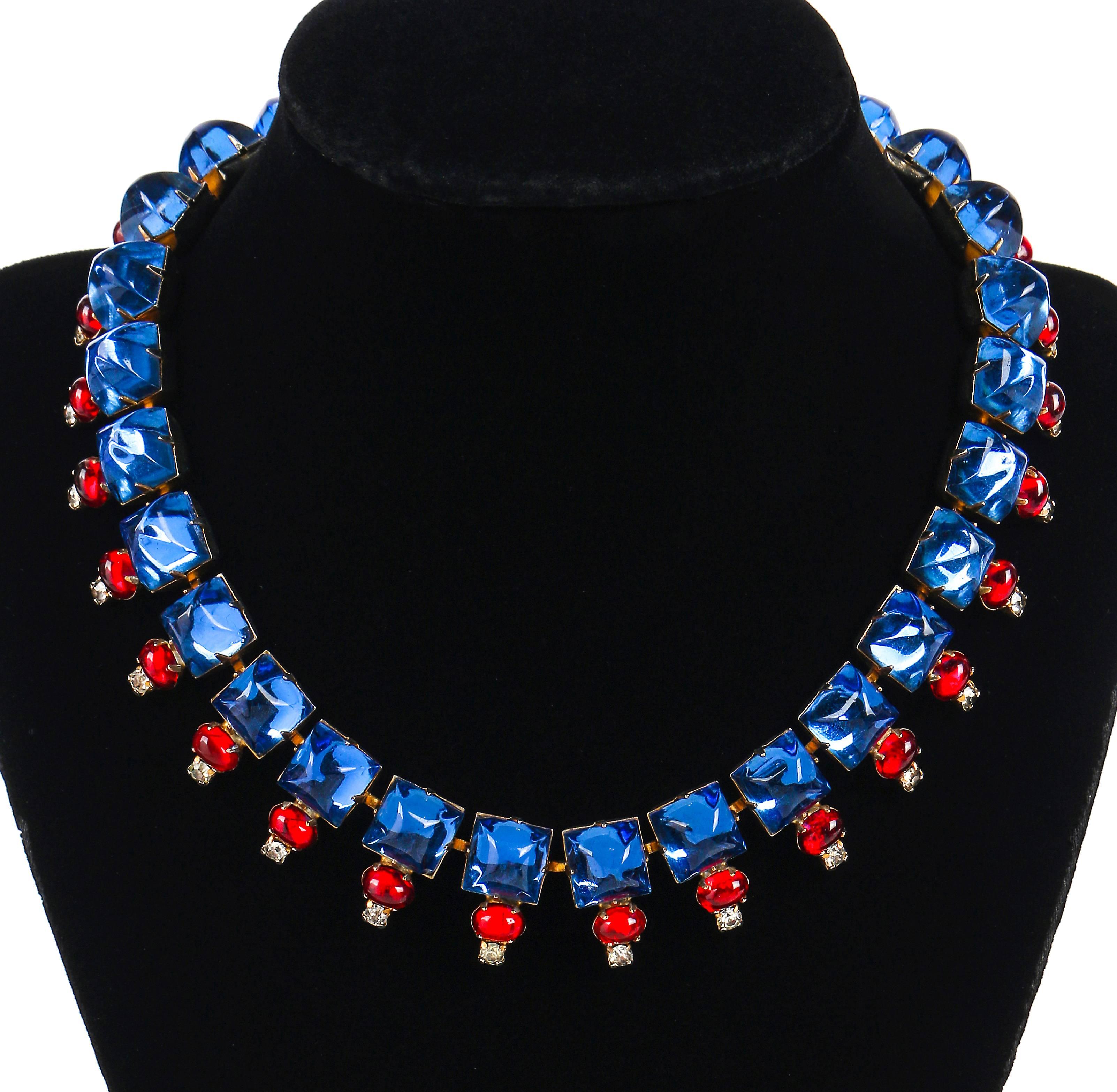 Vintage c.1960's Hattie Carnegie silver/gold tone setting with sapphire blue, ruby red, clear crystal cabochon glass rhinestone necklace. Large square domed prong set sapphire colored glass stones (measure approximately 10mm) are connected by a fine