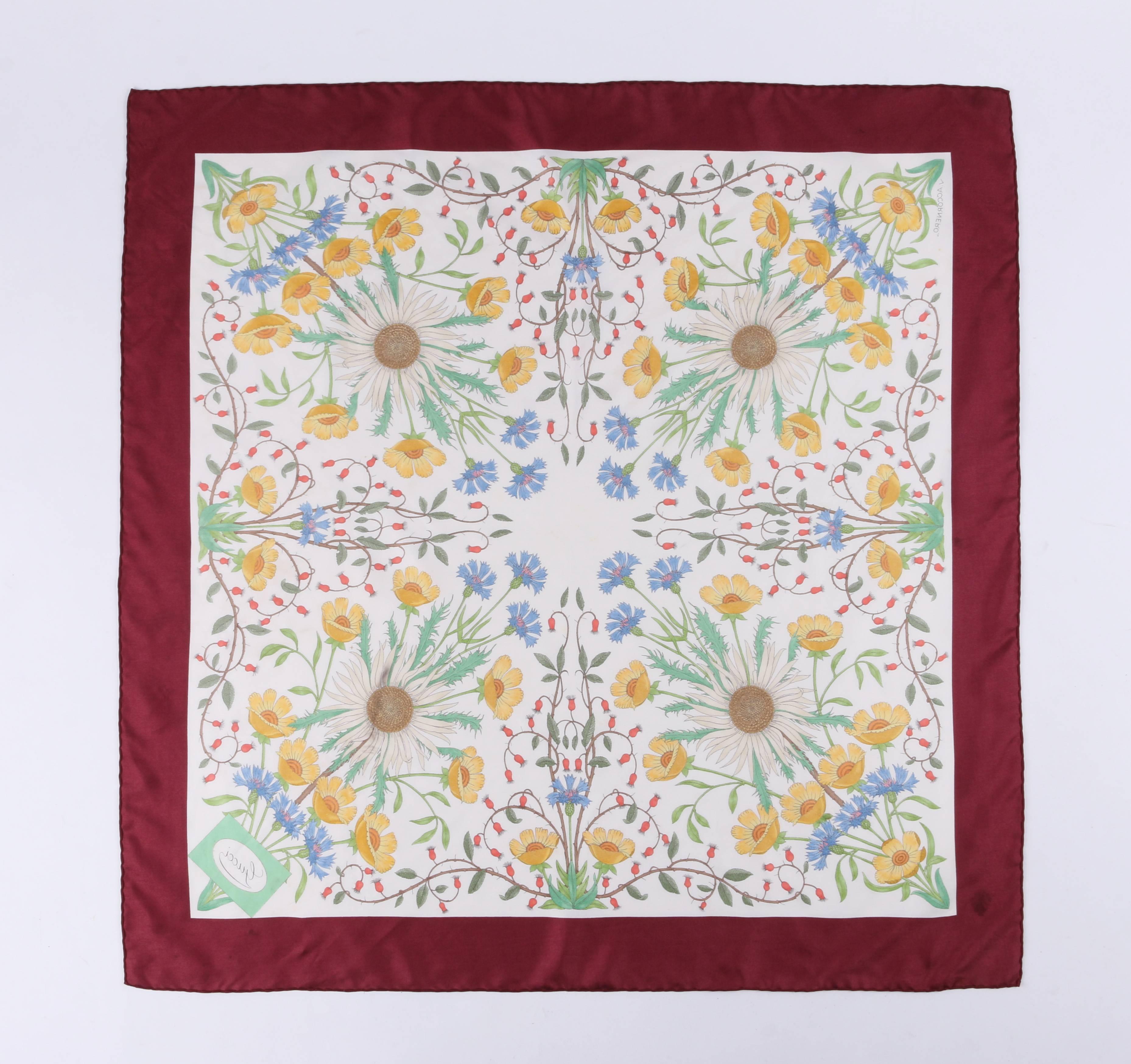 Gucci c.1970's multicolored floral print silk scarf designed by Viittorio Accornero. Wide burgundy border with ivory background and multicolored symmetrical floral print. Hand-rolled edges. 