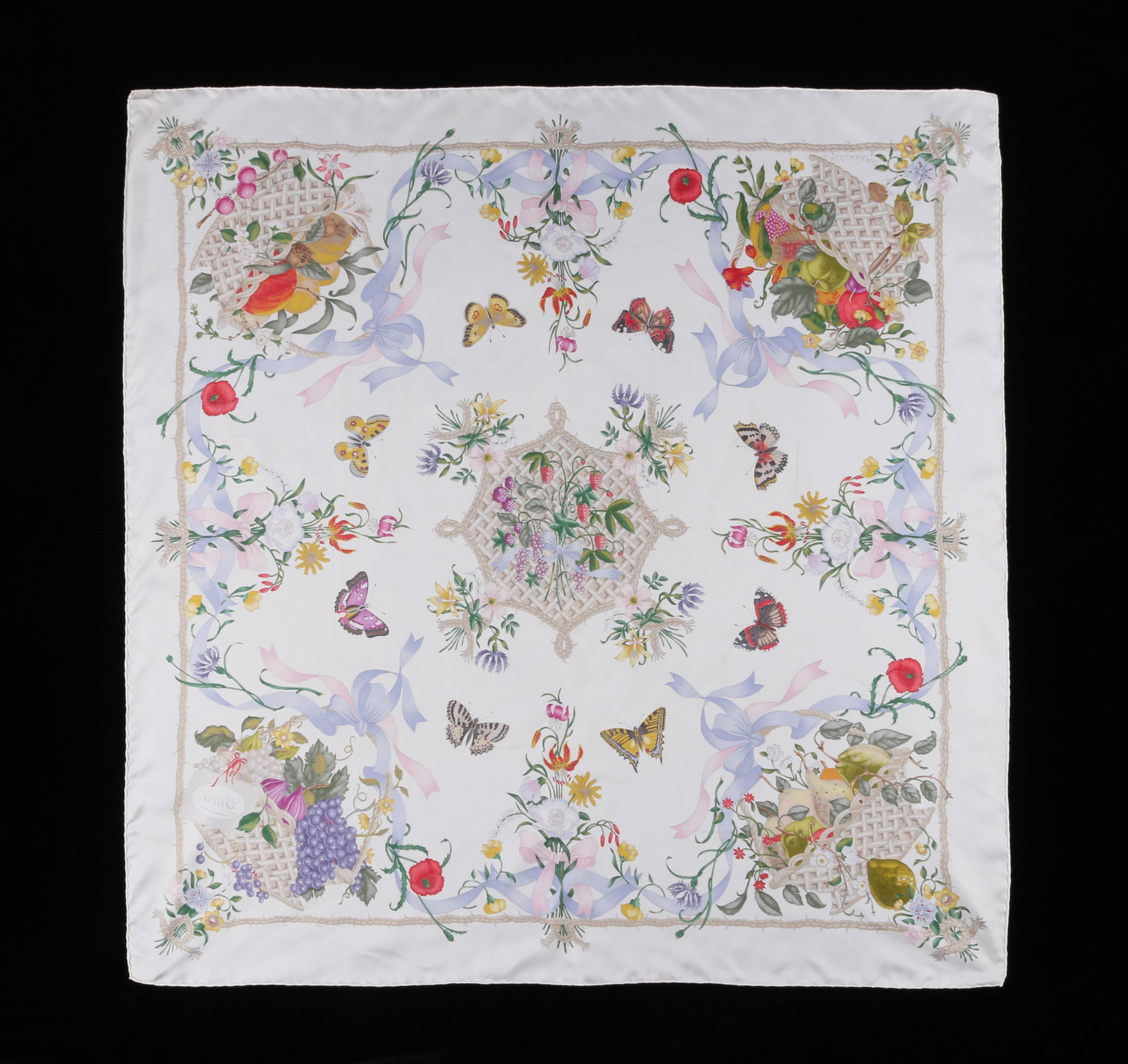 Gucci c.1970's multicolored floral butterfly fruit print silk scarf designed by Viittorio Accornero. Ivory background with beige rope border and multicolored symmetrical floral, fruit, and butterfly design. Hand rolled edges. 