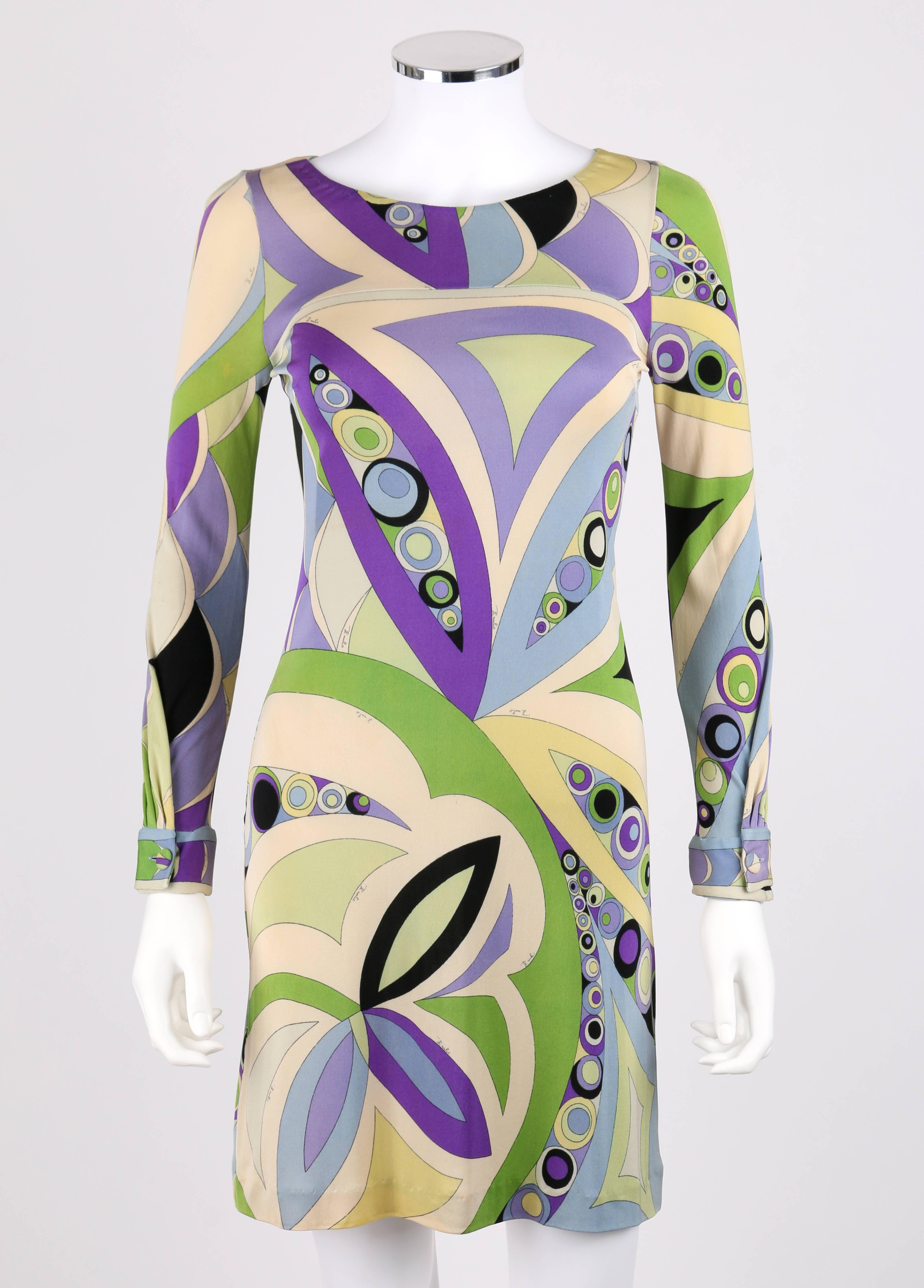 Vintage c.1960's Emilio Pucci signature print silk jersey sheath dress in shades of green, pale blue, and light purple. All over signature print. Round neckline. Long sleeves with covered button cuff closure. Matching 