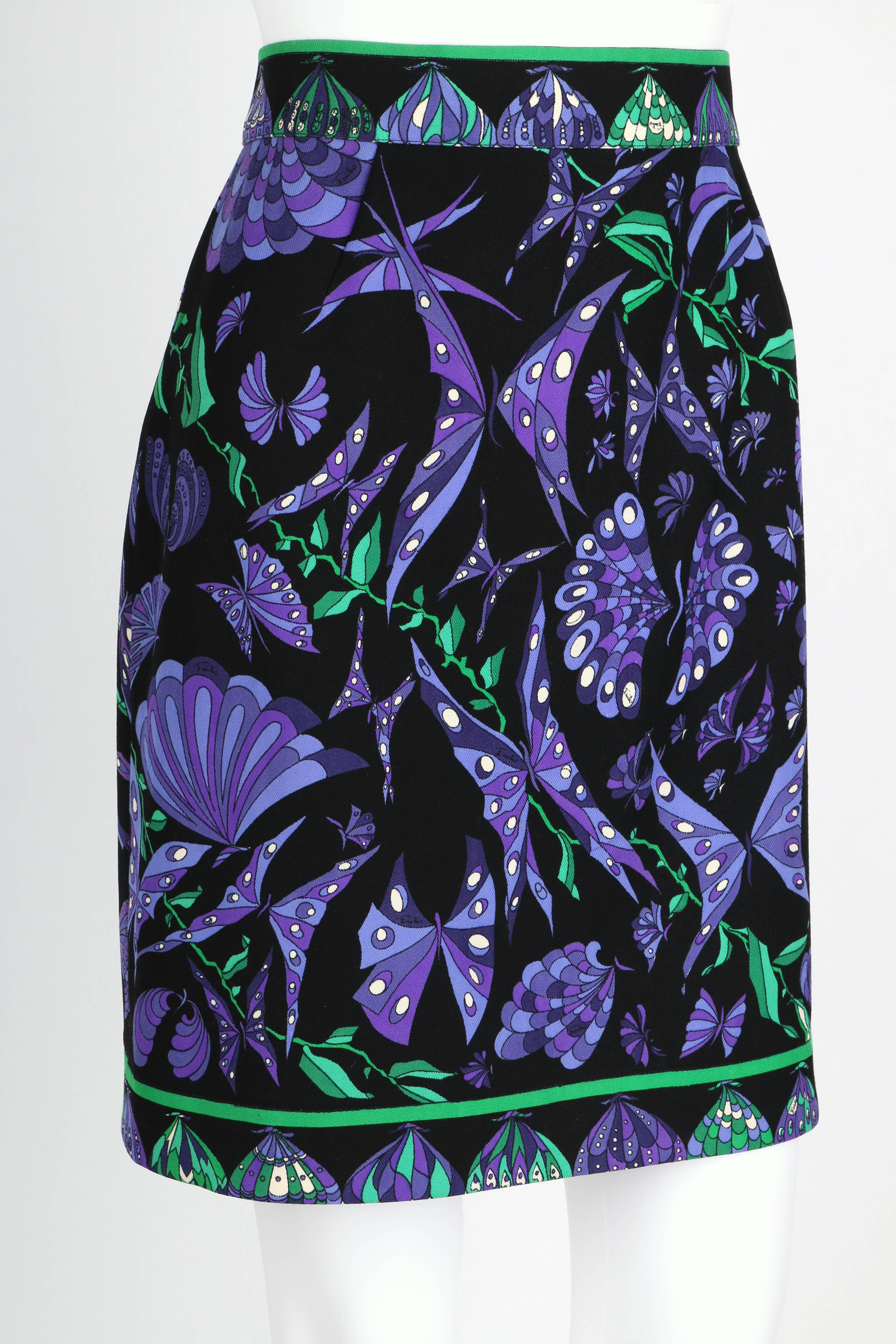 Emilio Pucci c.1970's black, purple and green butterfly signature print wool A-line skirt. Butterfly wing decorative border on waist, closure, and hem. Back zipper and button closure. Fully lined. Marked Fabric Content: 