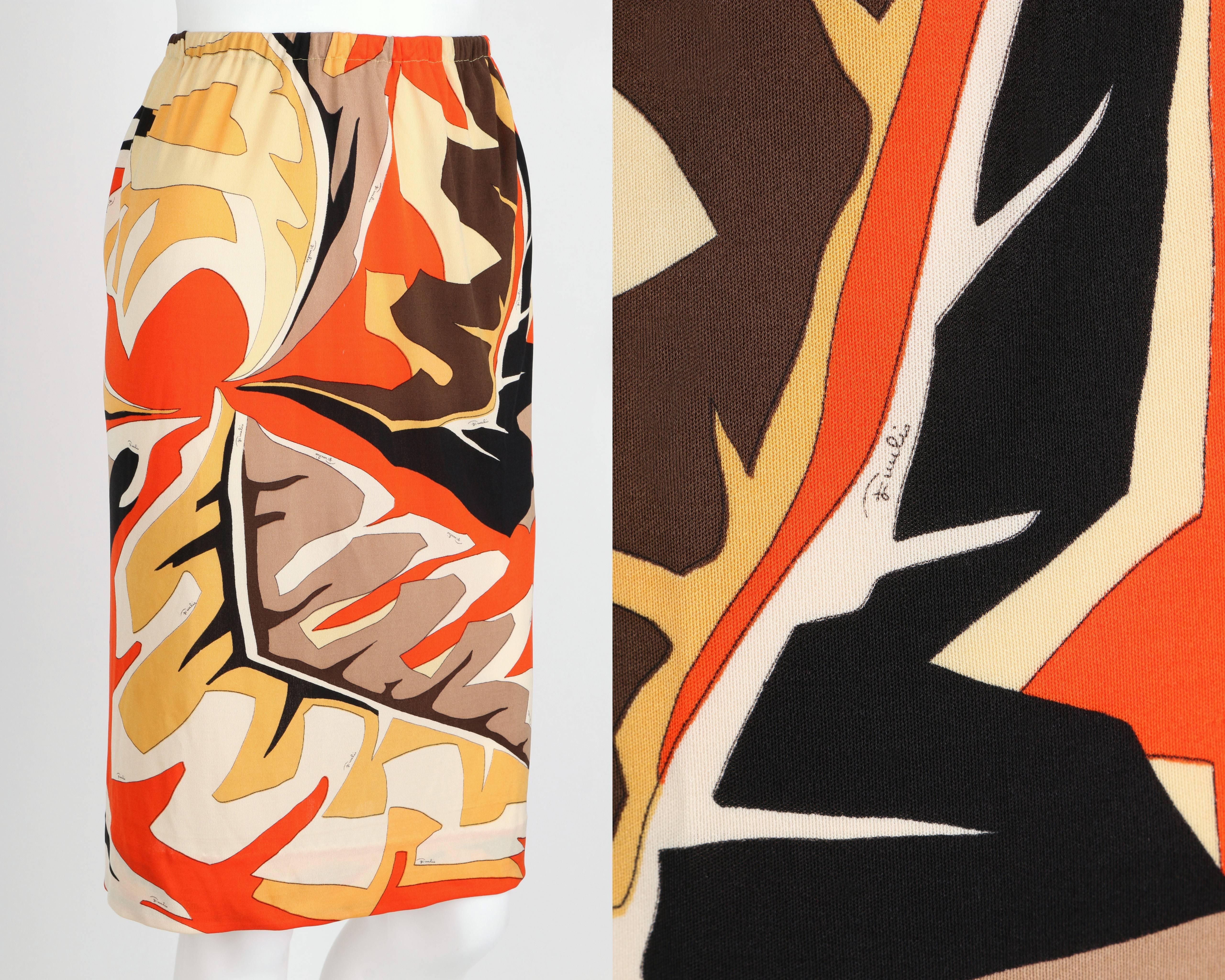 Vintage c.1960's Emilio Pucci African leaf signature print silk jersey skirt in shades of orange, yellow, brown and ivory. Inspired by his personal excursions to Africa. Decorative leaf border on left hip and back seam. Elastic waistband. Has been