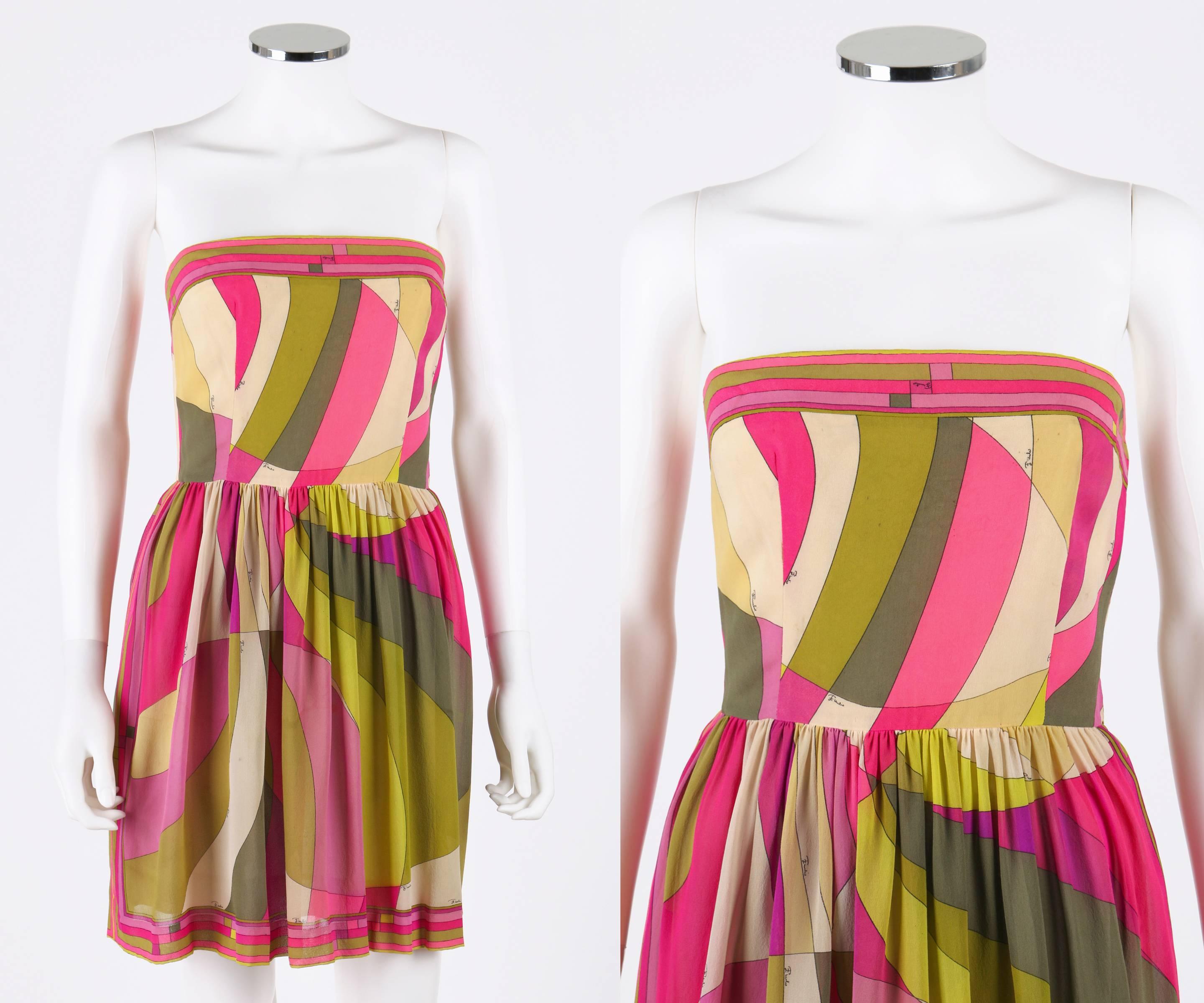 Vintage c.1960's Emilio Pucci silk strapless mini dress. Pink, green, purple, and ivory op art signature print. Decorative border detail at neckline and hem. Gather pleated skirt. Built in merry widow with spiral steel boning. Separate metal zipper