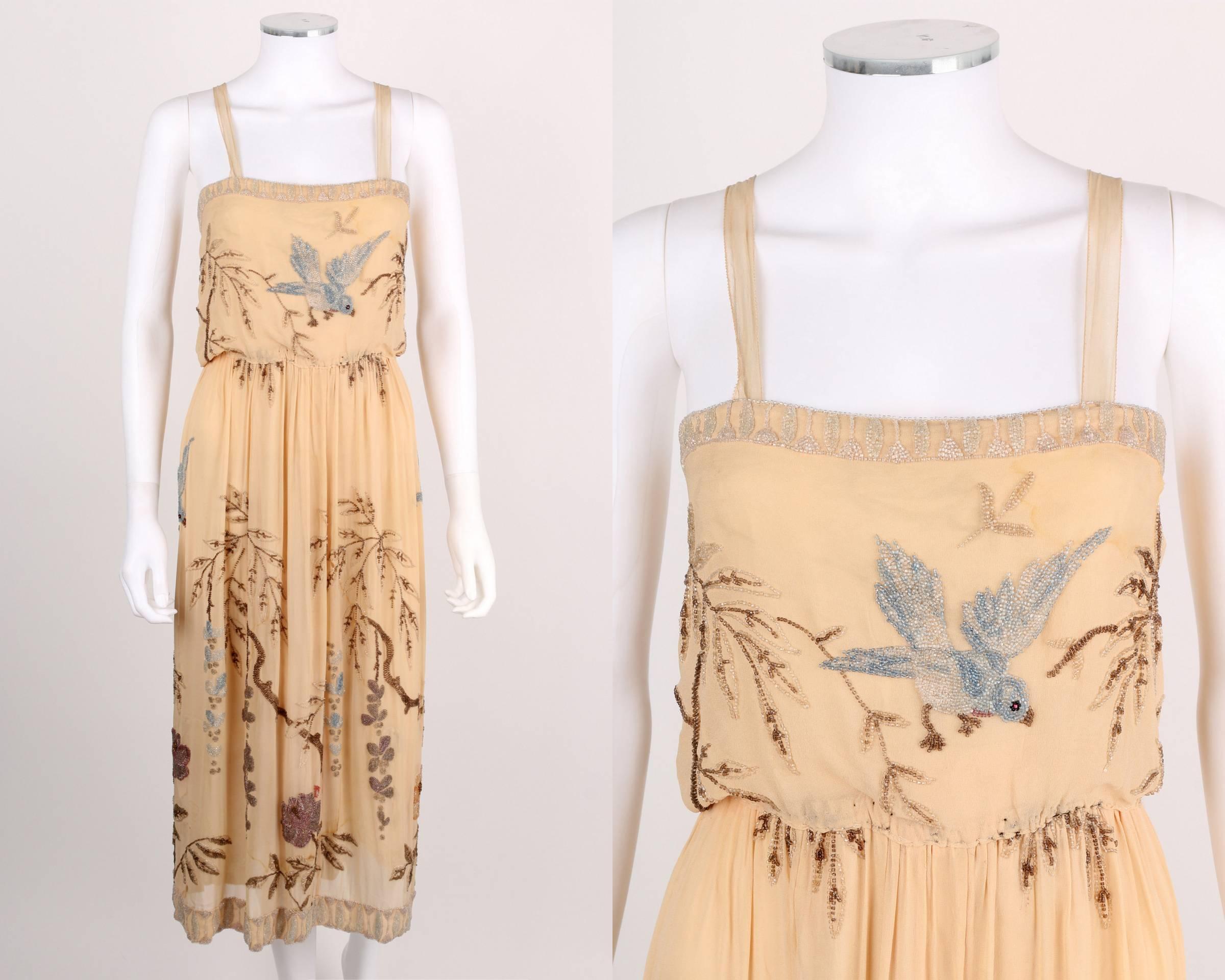 Sadie Nemser c.1920's Cream Floral Bird Bead Embellished Silk Evening Dress 

Brand / Manufacturer: Sadie Nemser
Designer: Sadie Nemser
Circa: 1920's
Style: Evening Dress
Color(s): Shades of cream, pink, brown, and blue
Lined: Yes
Unmarked Fabric
