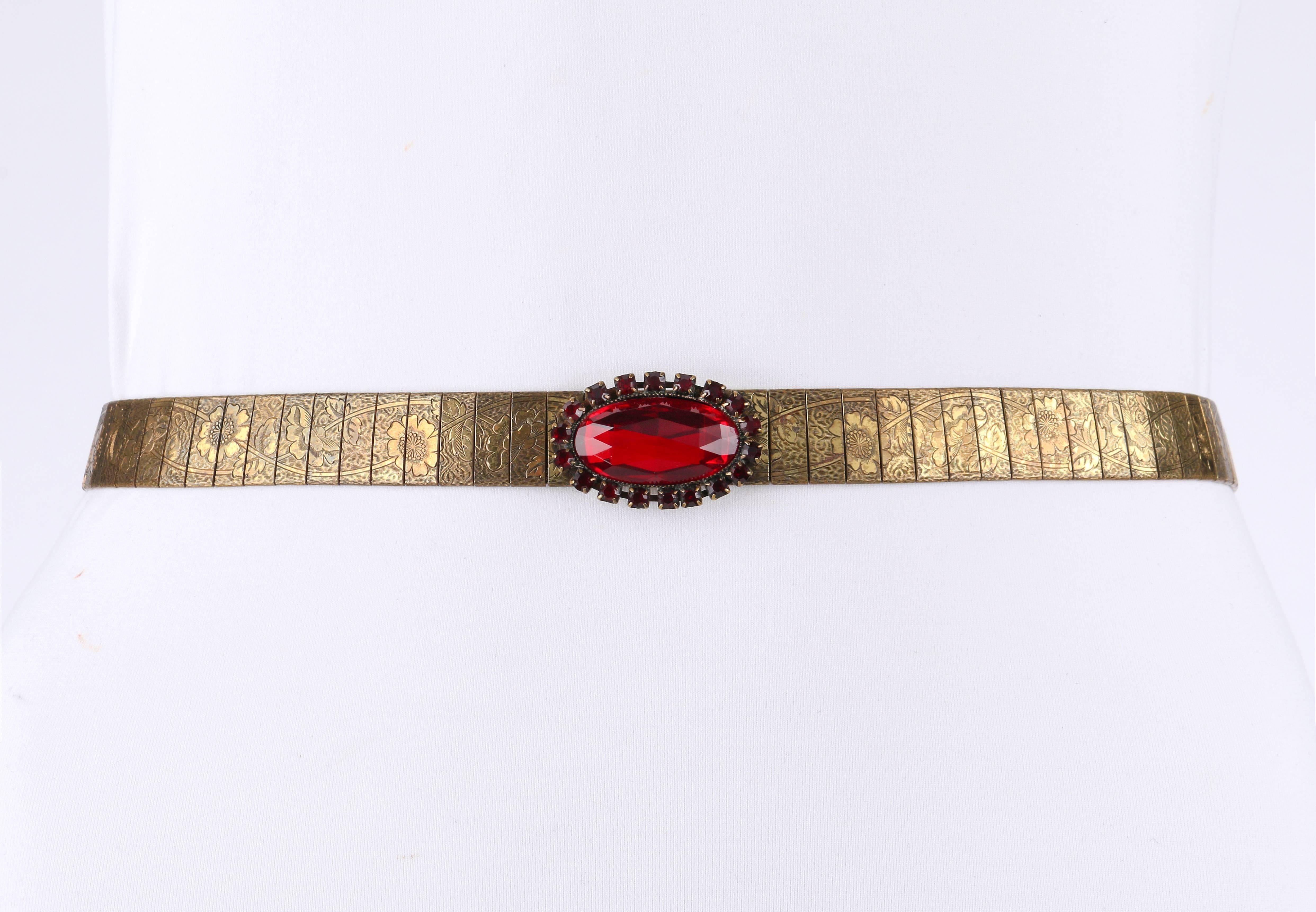 Vintage c.1930's Victorian Revival bronze tone mesh/link belt with faux ruby colored faceted cabochon stones and beads. Belt has bronze links carved with detailed floral design. Five large oval faceted ruby colored cabochon stones (1.5