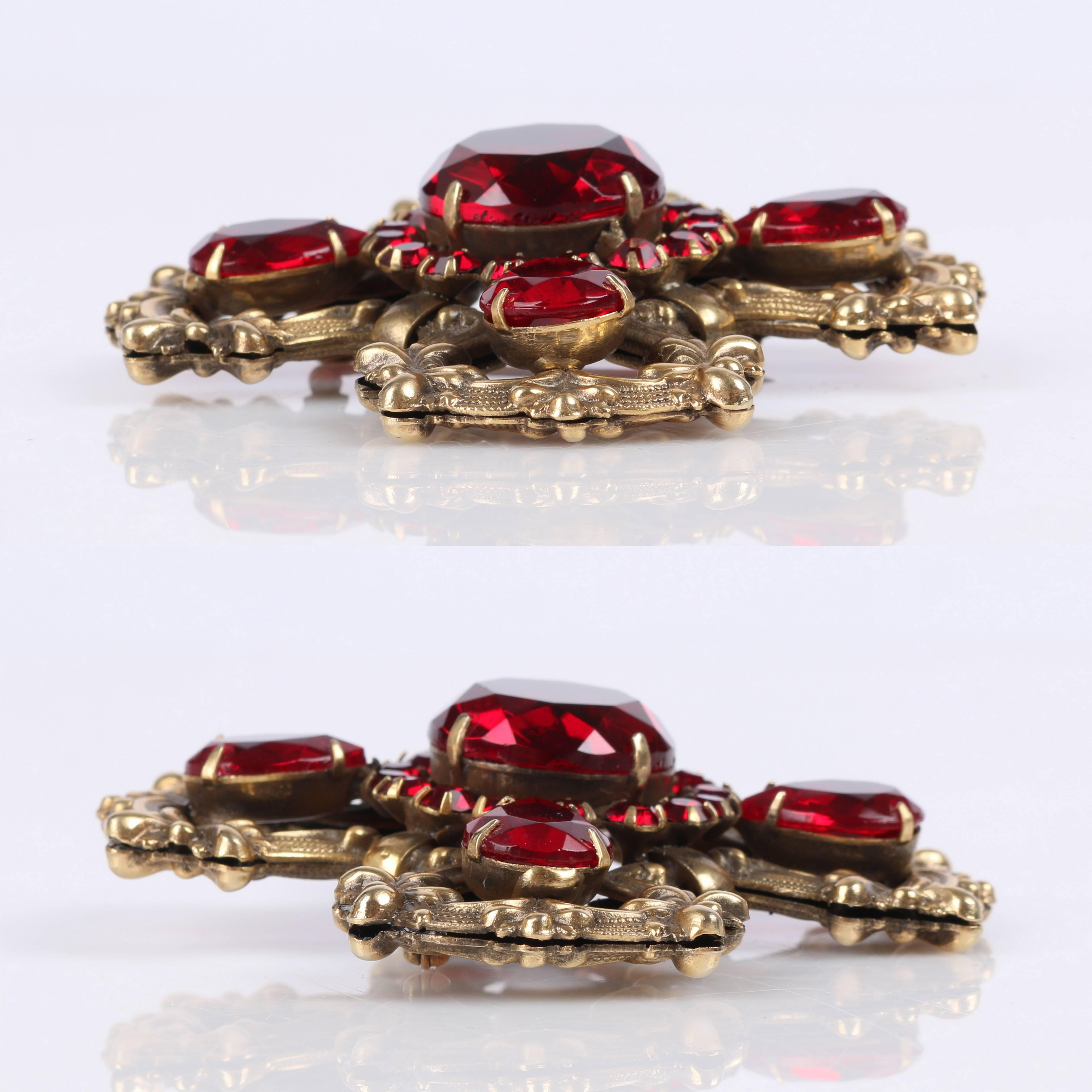 red gem brooch
