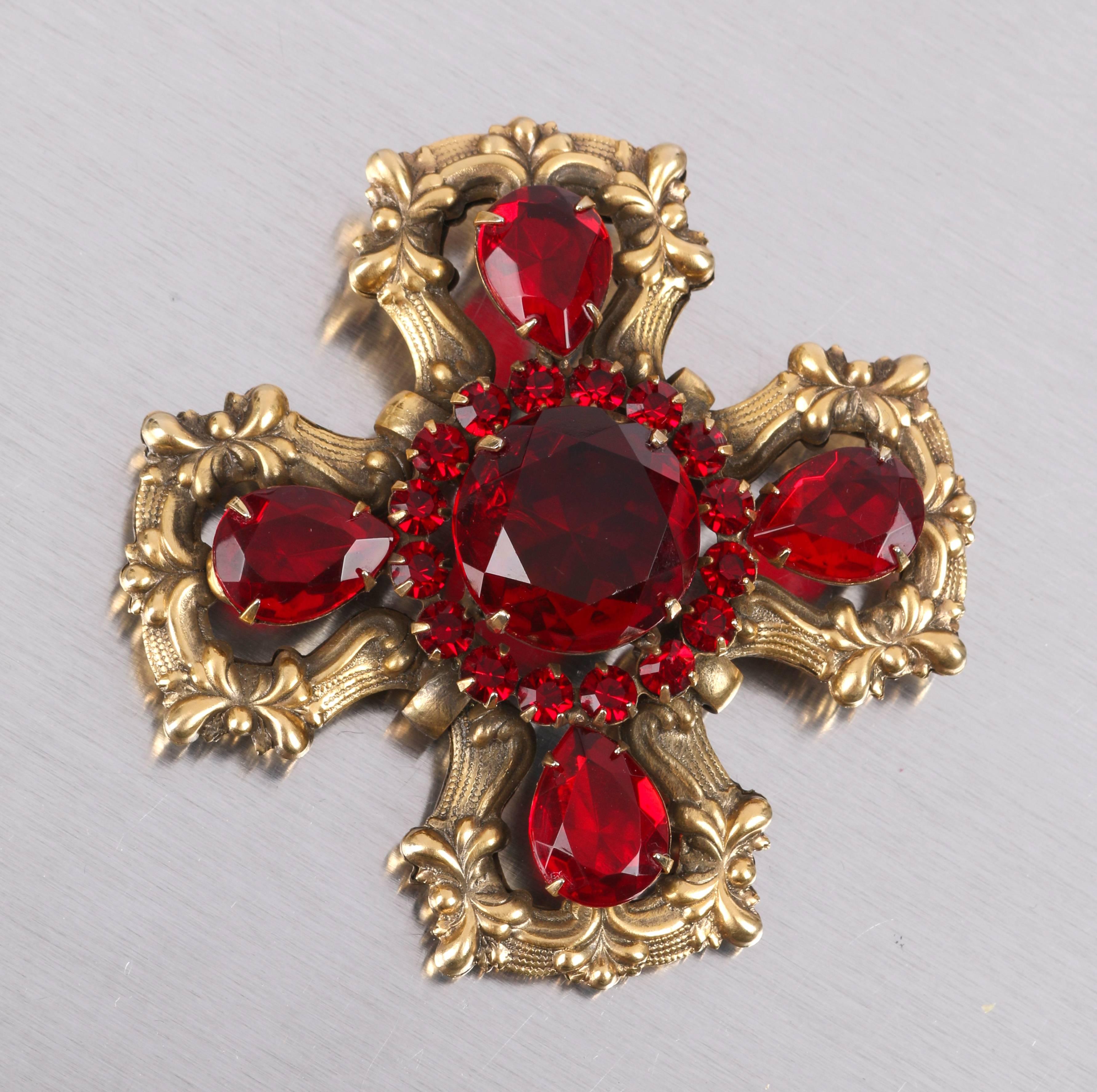 Vintage c.1940's Victorian Revival statement open work Maltese cross brass and ruby red gem brooch. Ornate open metal work setting with huge faceted ruby red glass round and teardrop shaped gems. Large center prong set round faceted ruby red glass
