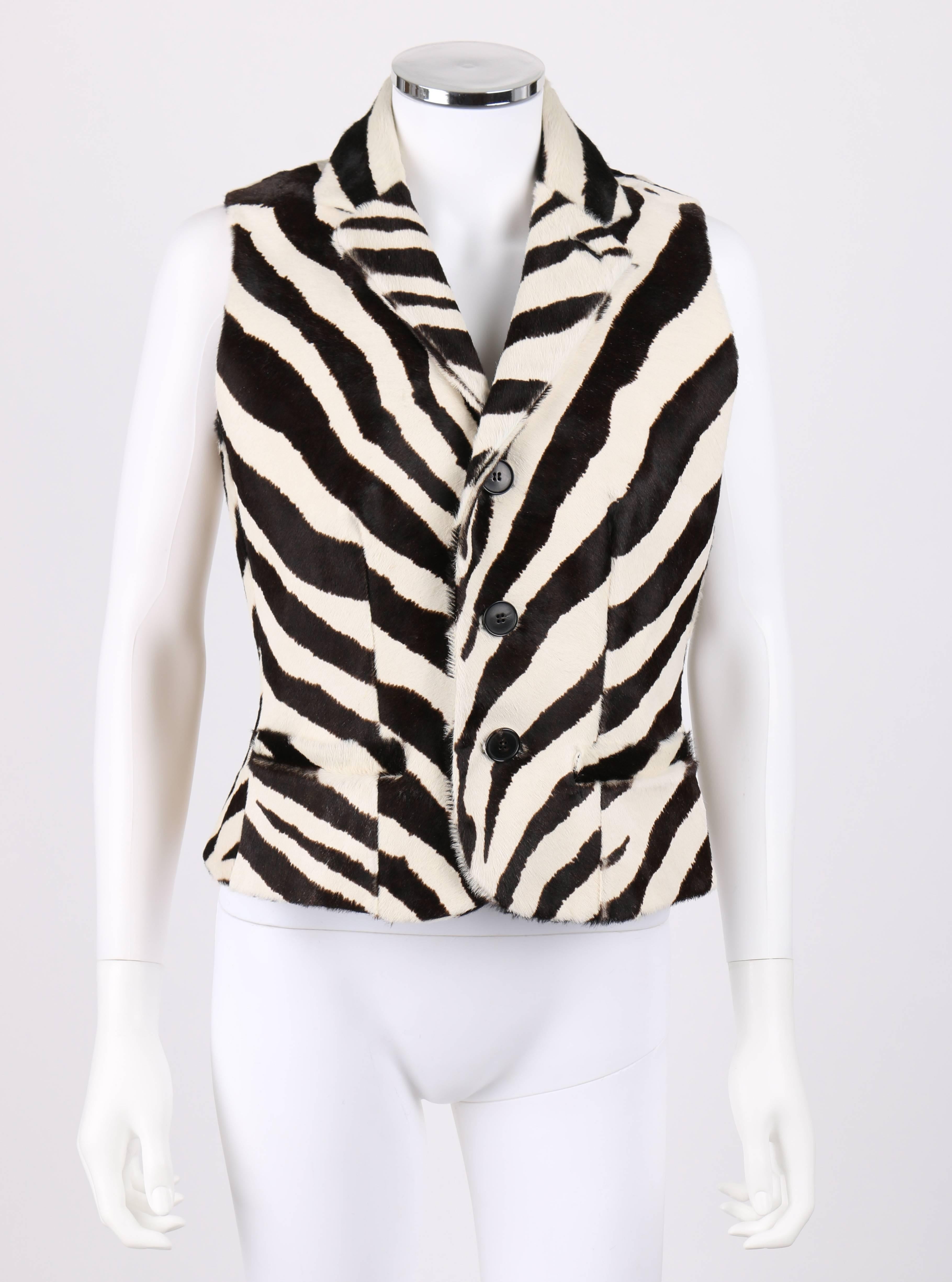 Ralph Lauren Collection (purple label) zebra print calfskin vest. New Old Stock. Ivory and brown zebra stripe printed calf hair fur. Notched lapel collar. Three center front button closures. Single button hole detail at left lapel. Two front single