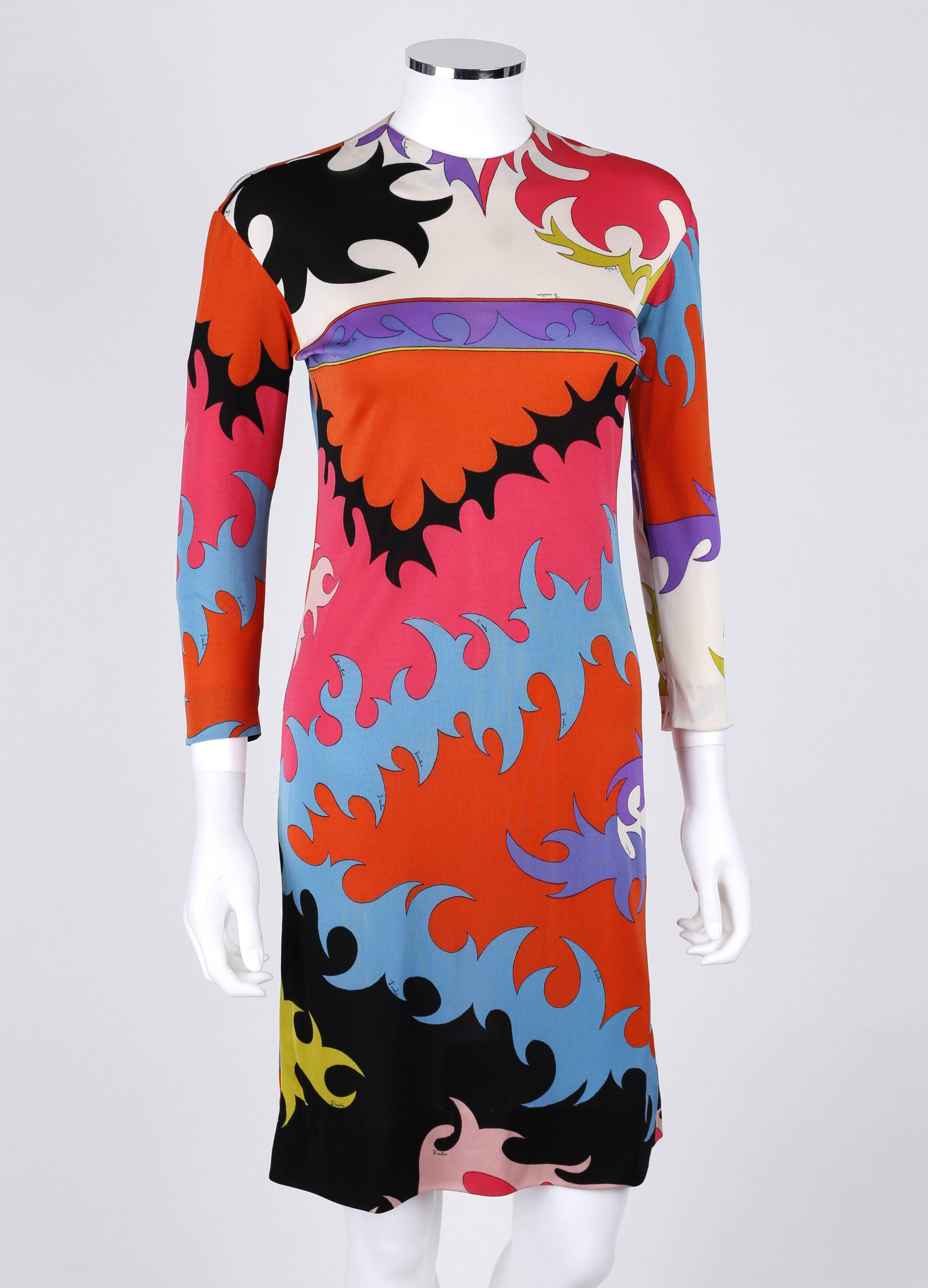 Vintage c.1960's Emilio Pucci for Saks Fifth Avenue silk jersey shift dress. Muticolor abstract signature print in shades of pink, orange, green, blue, purple, black, and white. 3/4 length sleeves. Crew neck. Center back invisible zipper with hook
