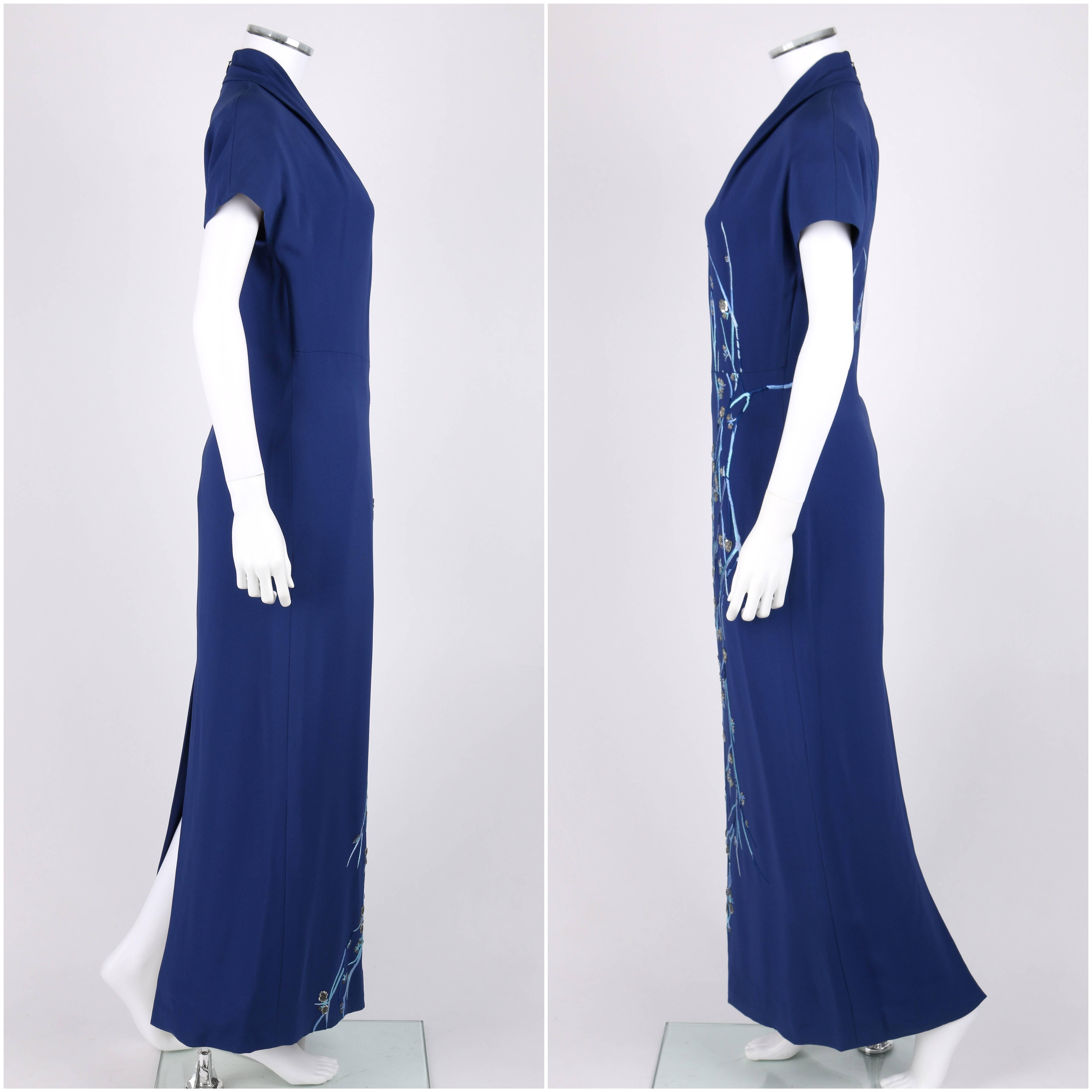 Givenchy Couture A/W 1998 royal blue evening dress designed by Alexander McQueen. Floral embroidery in shades of blue with clear glass beads and silver sequins. Short dolman sleeves. V-neckline. Center back invisible zipper with hook and eye