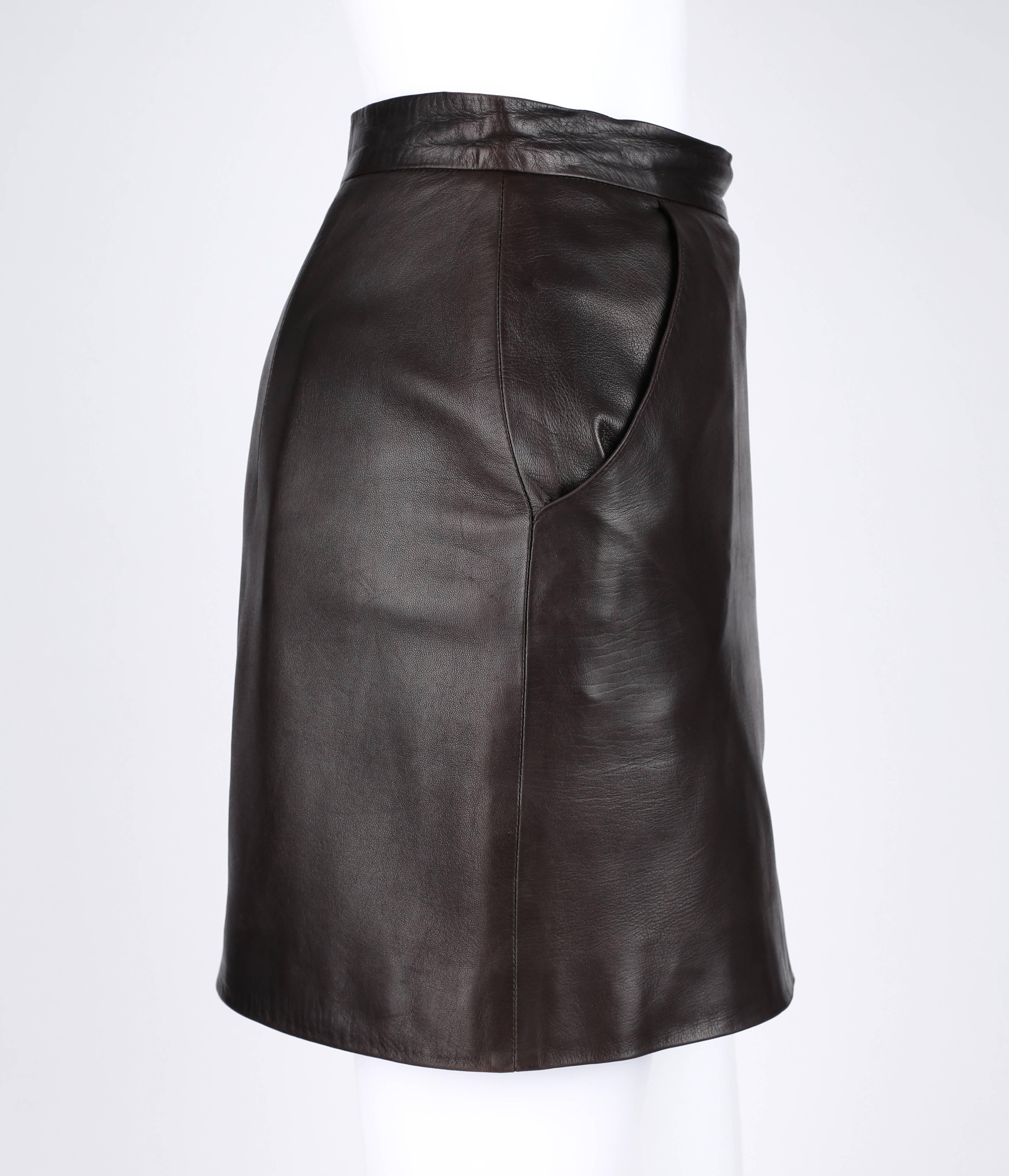 Givenchy Couture A/W 1997 designed by Alexander McQueen from the "Lady Leopard" collection. Dark brown genuine leather mini skirt. Two front angled hip pockets. Side left front slit. Back darts. Side invisible zipper with single button and