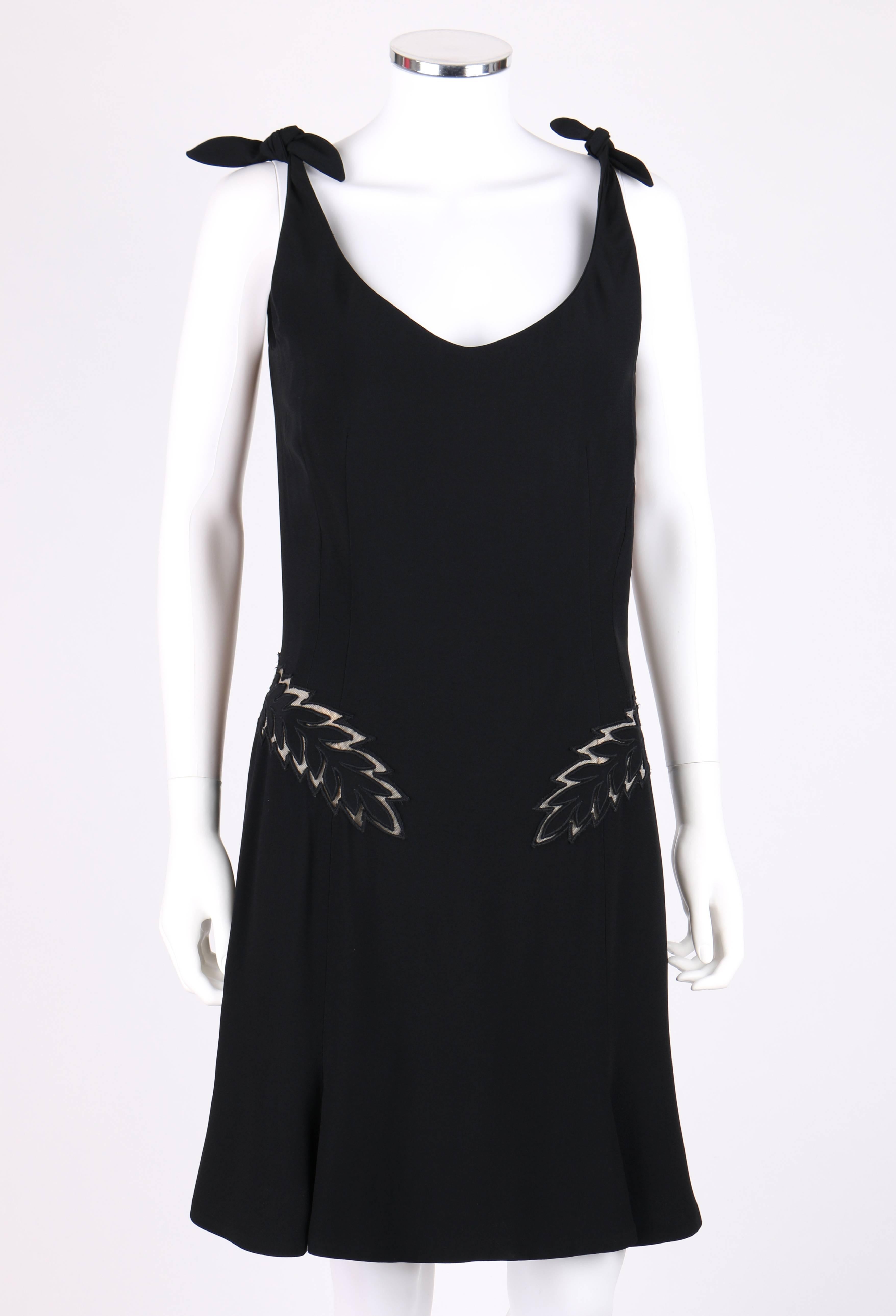 Alexander McQueen S/S 2006 black sleeveless cut work cocktail dress. From Alexander McQueen's 