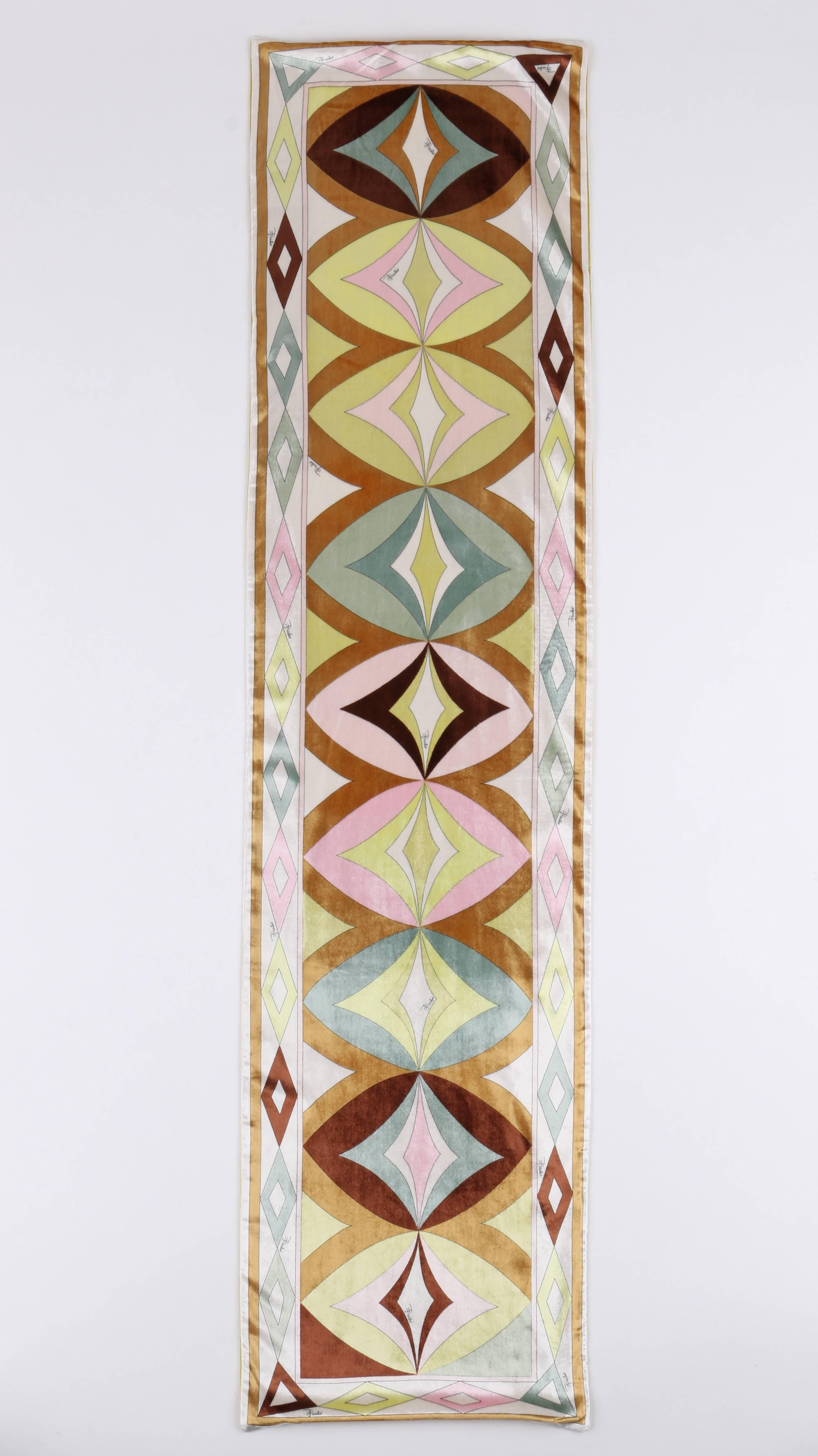 Emilio Pucci A/W 2004 (designed by Christian Lacroix) silk velvet oblong scarf. Geometric op art signature print in shades of ivory, pink, yellow, brown, and green. Yellow satin back. Long oblong shape. Unmarked Fabric Content: Viscose/Cupro blend.