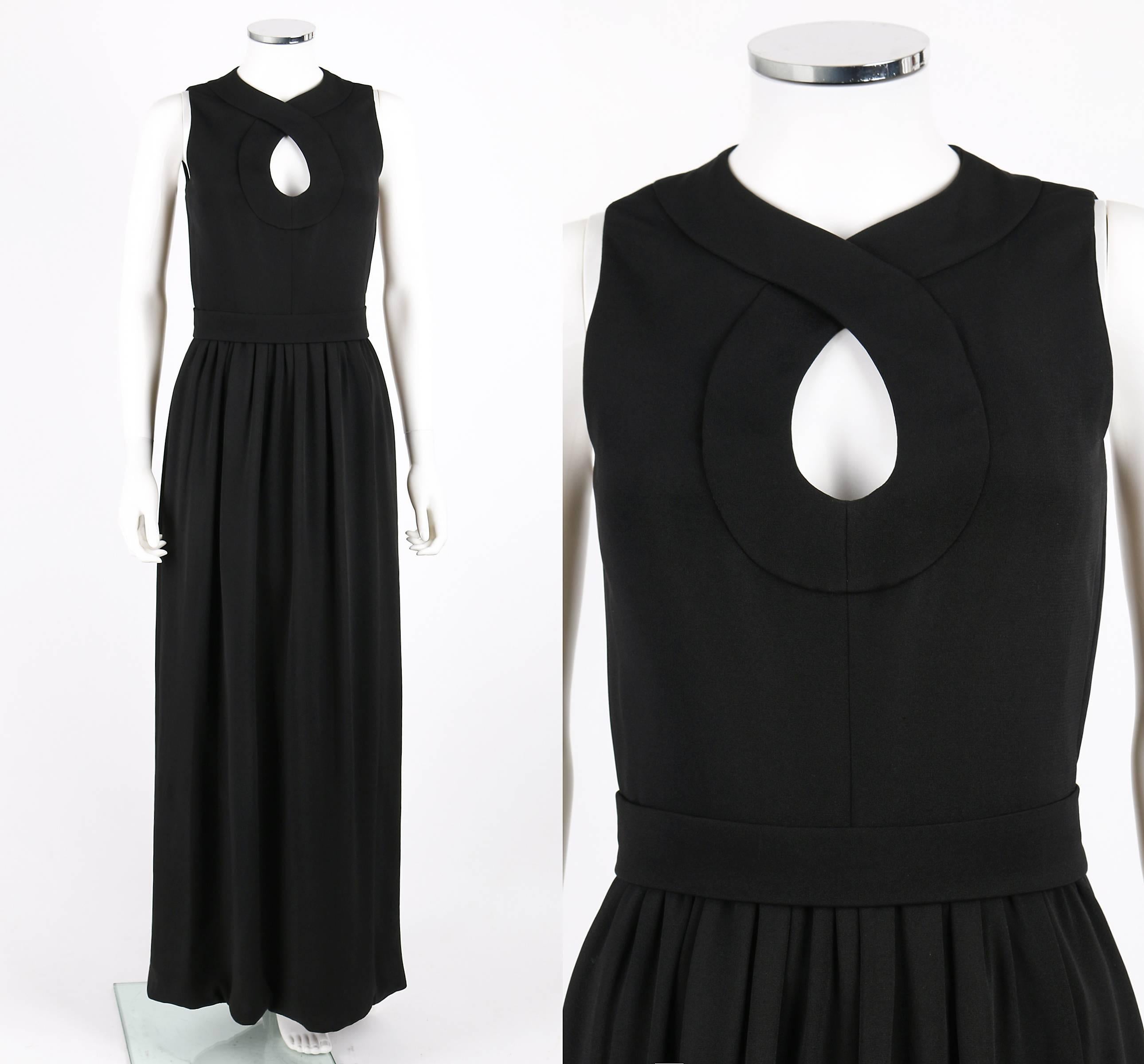 Vintage c.1960's Donald Brooks black wool sleeveless evening gown. Keyhole neckline with wide trim detail. Long gathered skirt. Center back invisible zipper with three covered button and loop closures and single snap closure at top. Matching