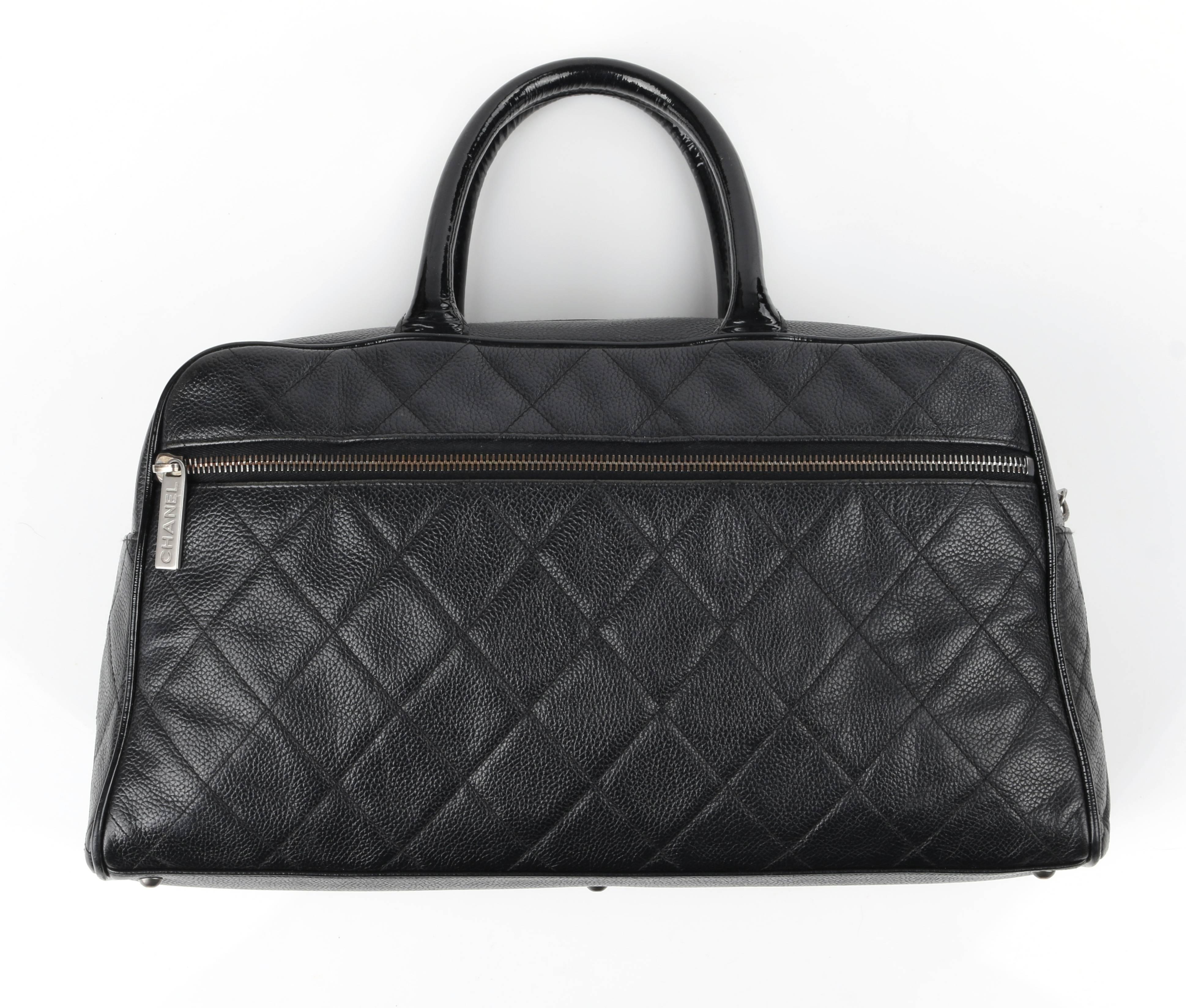 Chanel caviar (black) diamond quilted and patent leather boston / bowler bag. Designed by Karl Lagerfeld. Black diamond quilted leather body with patent leather piping. Two black patent leather single rolled top handles. Center front 
