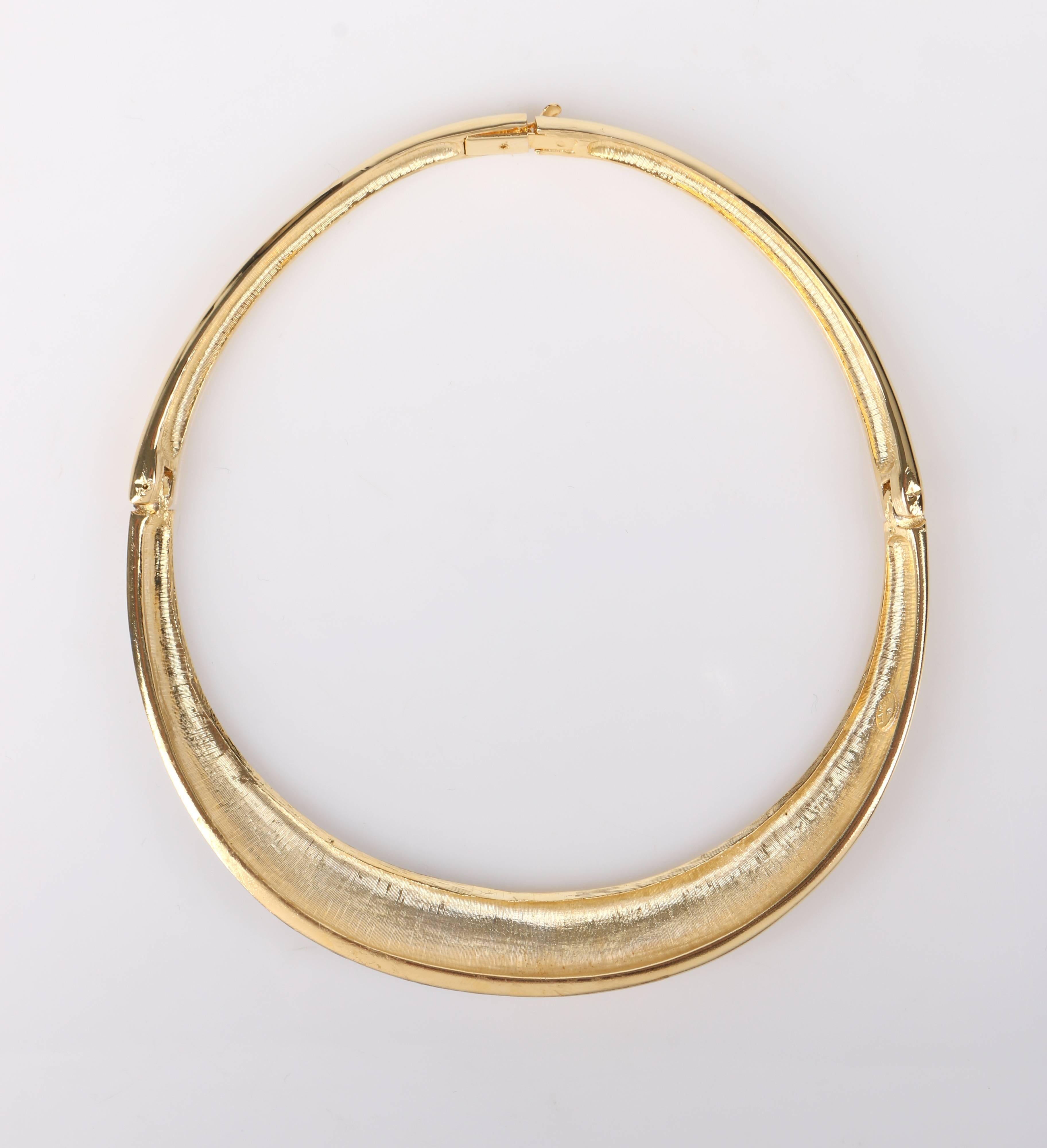 Vintage Lanvin c.1970's gold-toned metal and crystal rhinestone modernist collar choker necklace. Designed by Jules-François Crahay. Polished gold-toned collar has silver crystal rhinestone segment at left front. Segment is separated at the middle