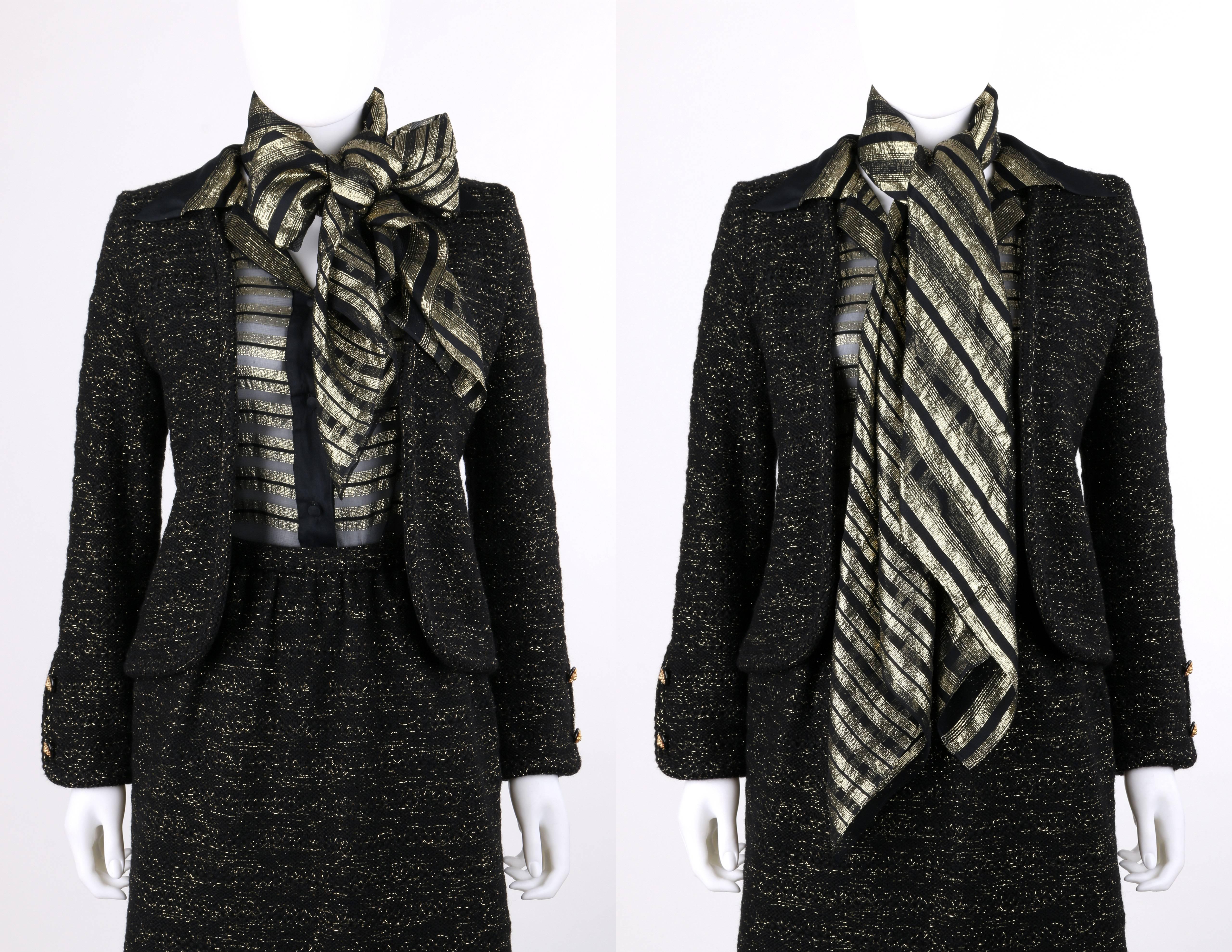Vintage Chanel Creations c.1970's four piece black and gold lurex jacket blouse skirt suit set with scarf. Black wool and metallic gold knit jacket. Open front style. Long sleeves with two black and gold-toned lion head button detail at cuffs.