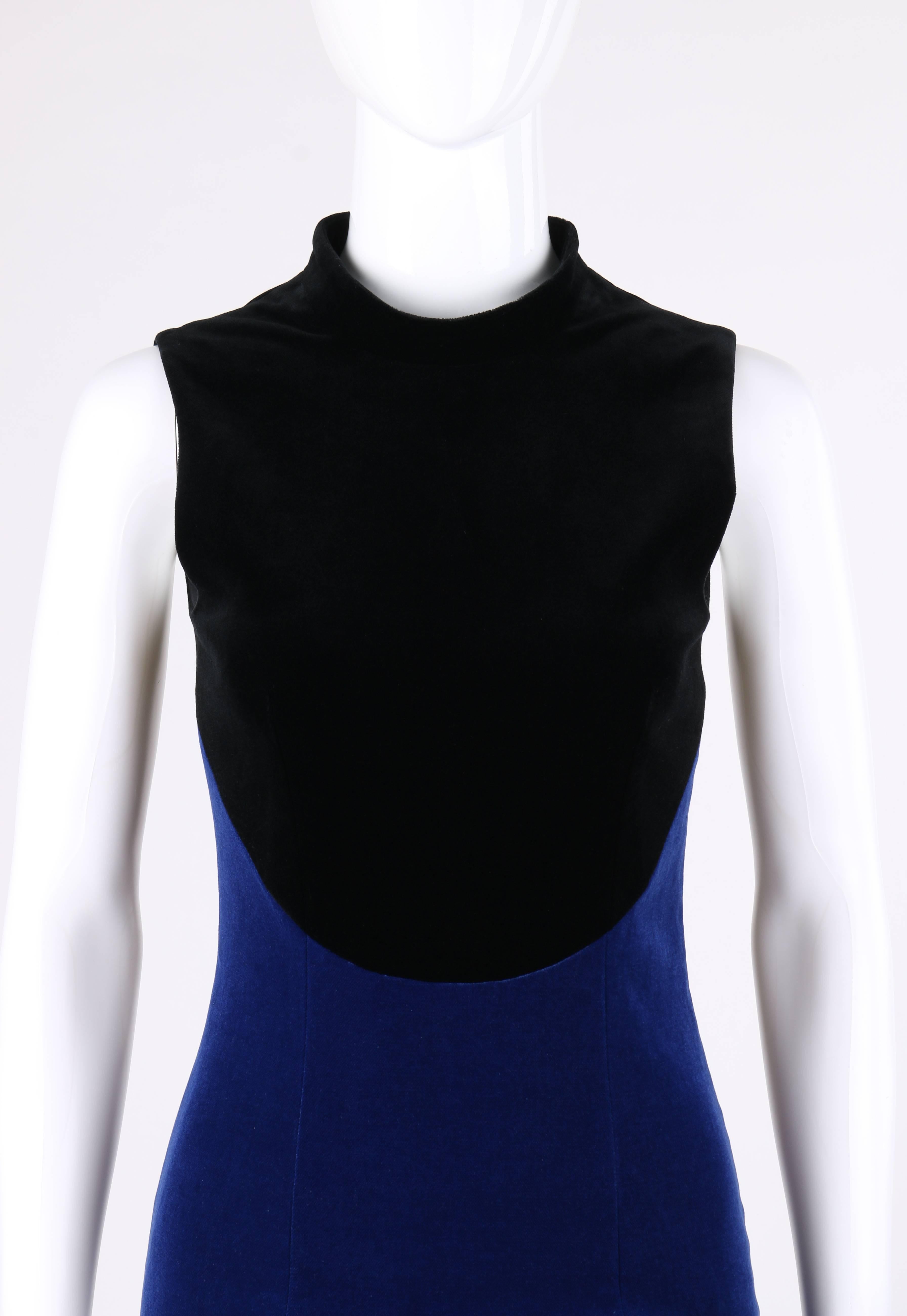 Christopher Kane Pre-Fall 2013 black and royal blue two-tone velvet cocktail dress. Runway look #4. Two-tone velvet with curved dividing seam between black bodice and royal blue shift style skirt. Mandarin collar. Sleeveless. Center back vent.