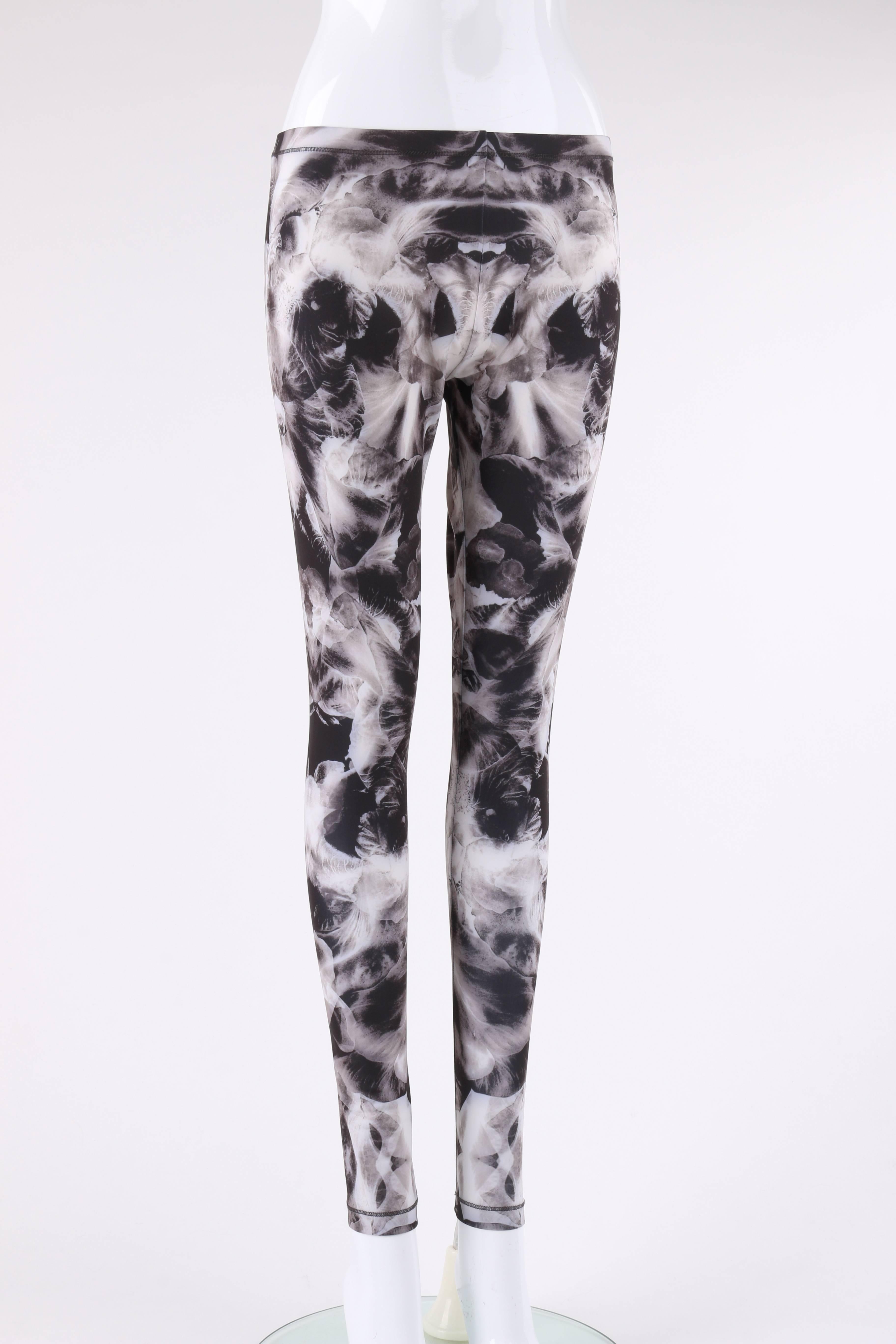 McQ by Alexander McQueen Spring/Summer 2013 mirrored Iris print leggings designed by Sarah Burton. All over mirrored Iris print in shades of gray. Elastic waistband. Slip-on style. Marked Fabric Content: 
