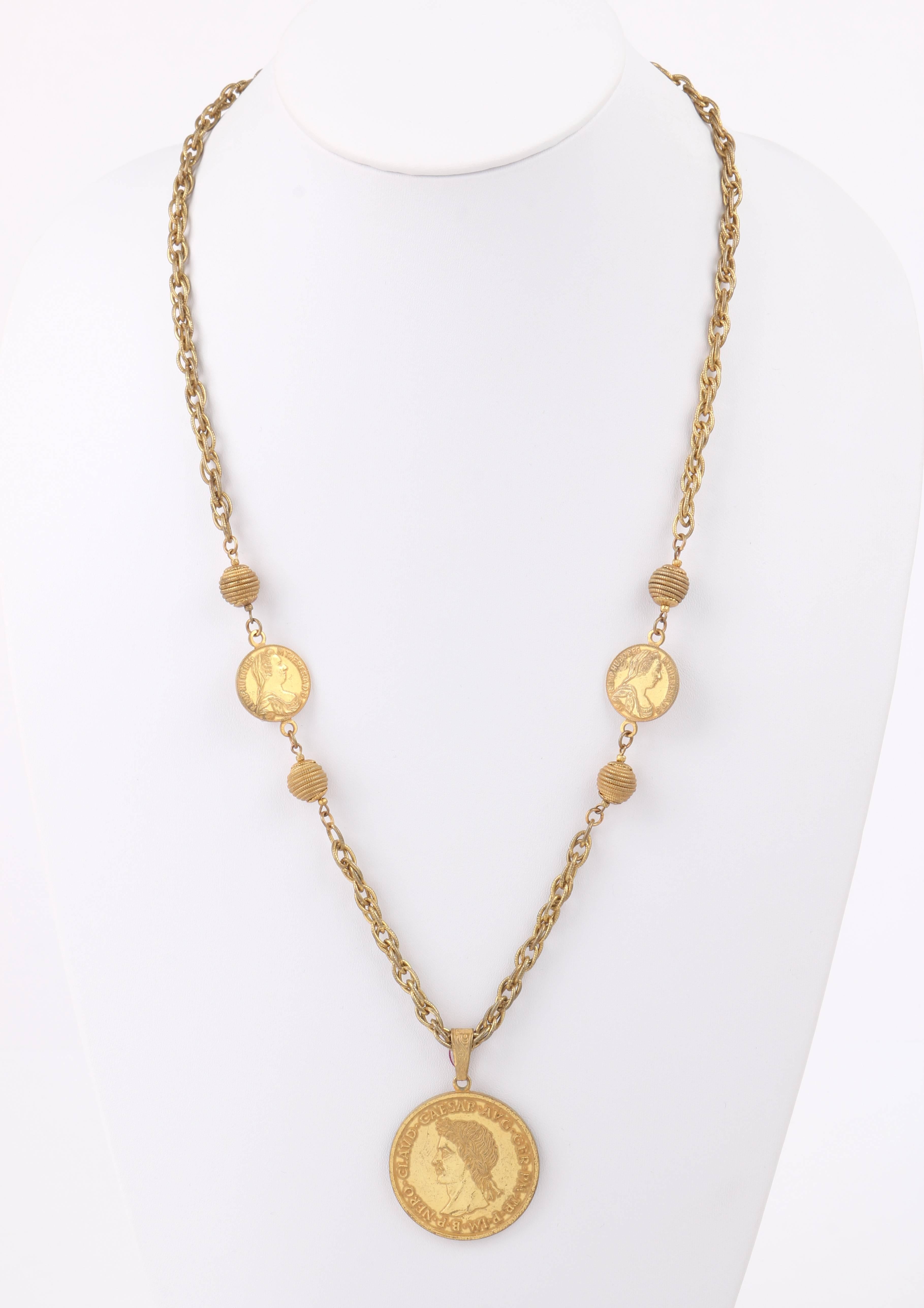 Vintage Miriam Haskell c.1960's gold-toned coin medallion pendant necklace. Large roman imperial coin medallion with Nero Caesar head on one side and a roman seated in military dress on the other. Medallion is suspended with an etched floral