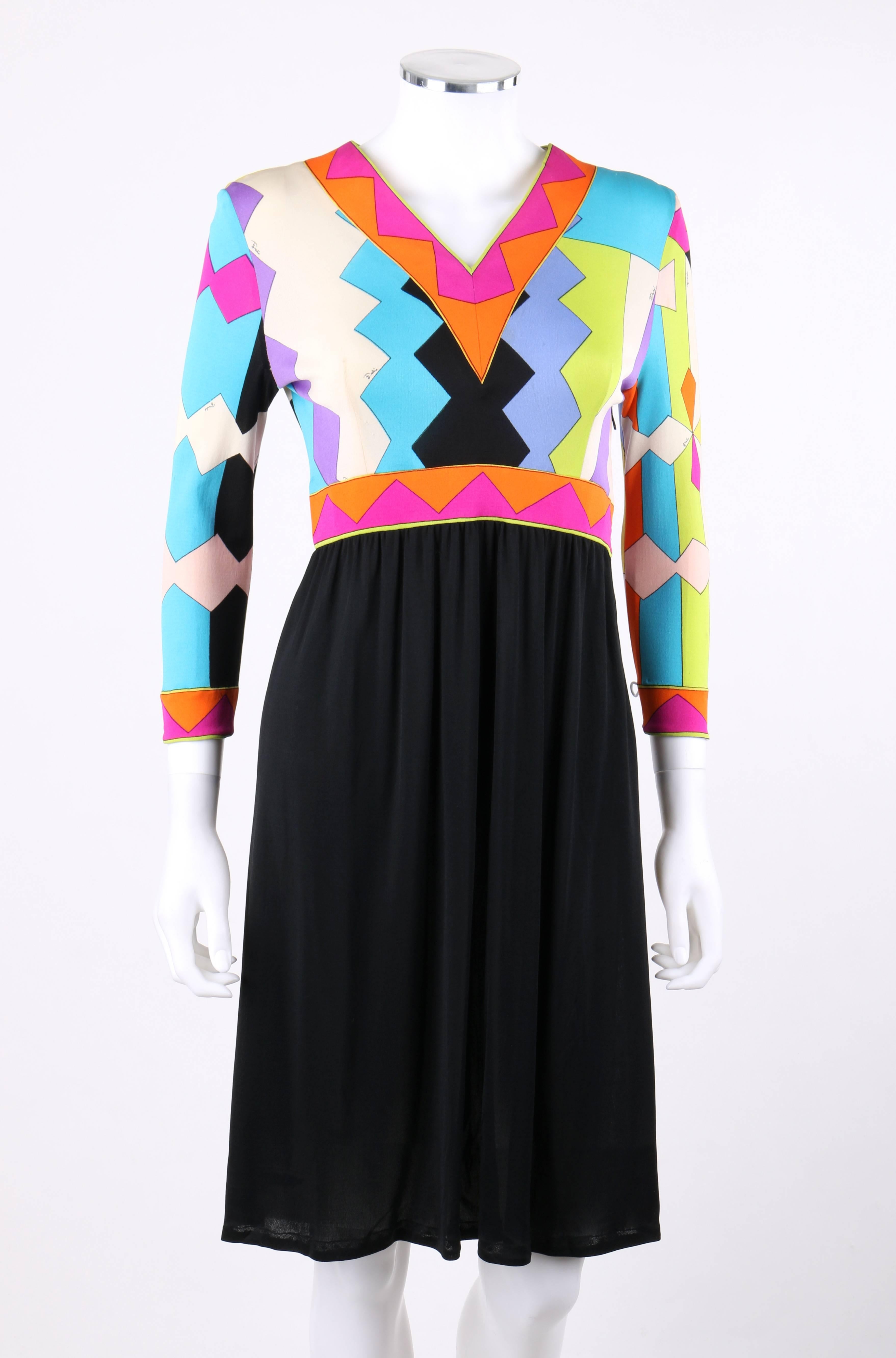 Vintage Emilio Pucci c.1960's geometric signature print silk jersey knit shift dress. Multicolor geometric zig-zag / rectangular print in shades of orange, magenta, yellow, lime, teal blue, white, pink, and black. V-neckline. 3/4 length sleeves.