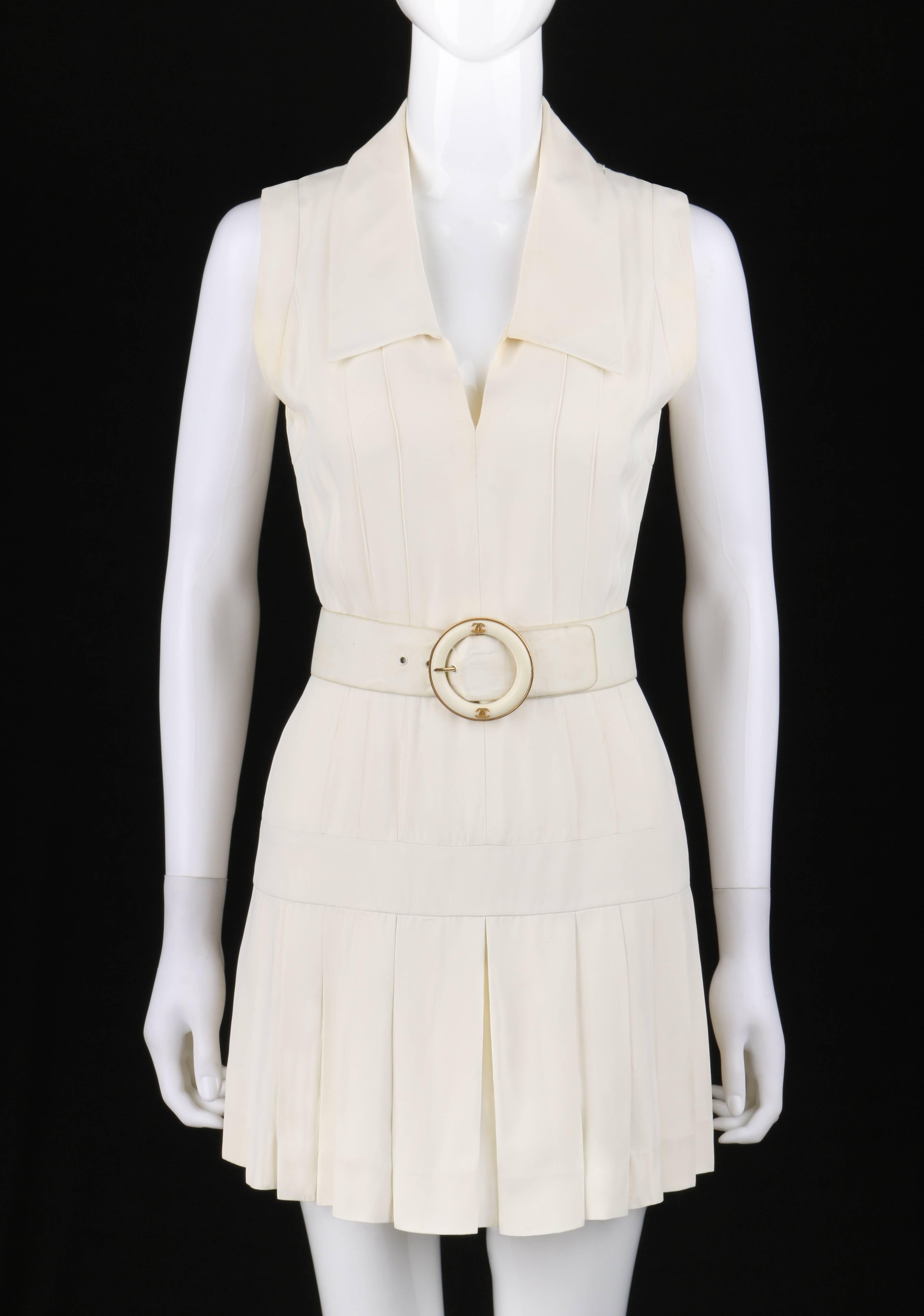 Vintage Chanel Boutique c.1980's winter white silk pleated drop waist dress with belt. Designed by Karl Lagerfeld. Chelesa collar. V-neckline. Sleeveless. Banded drop waist. Pin tuck seam detail from shoulders to drop waist at front and back.