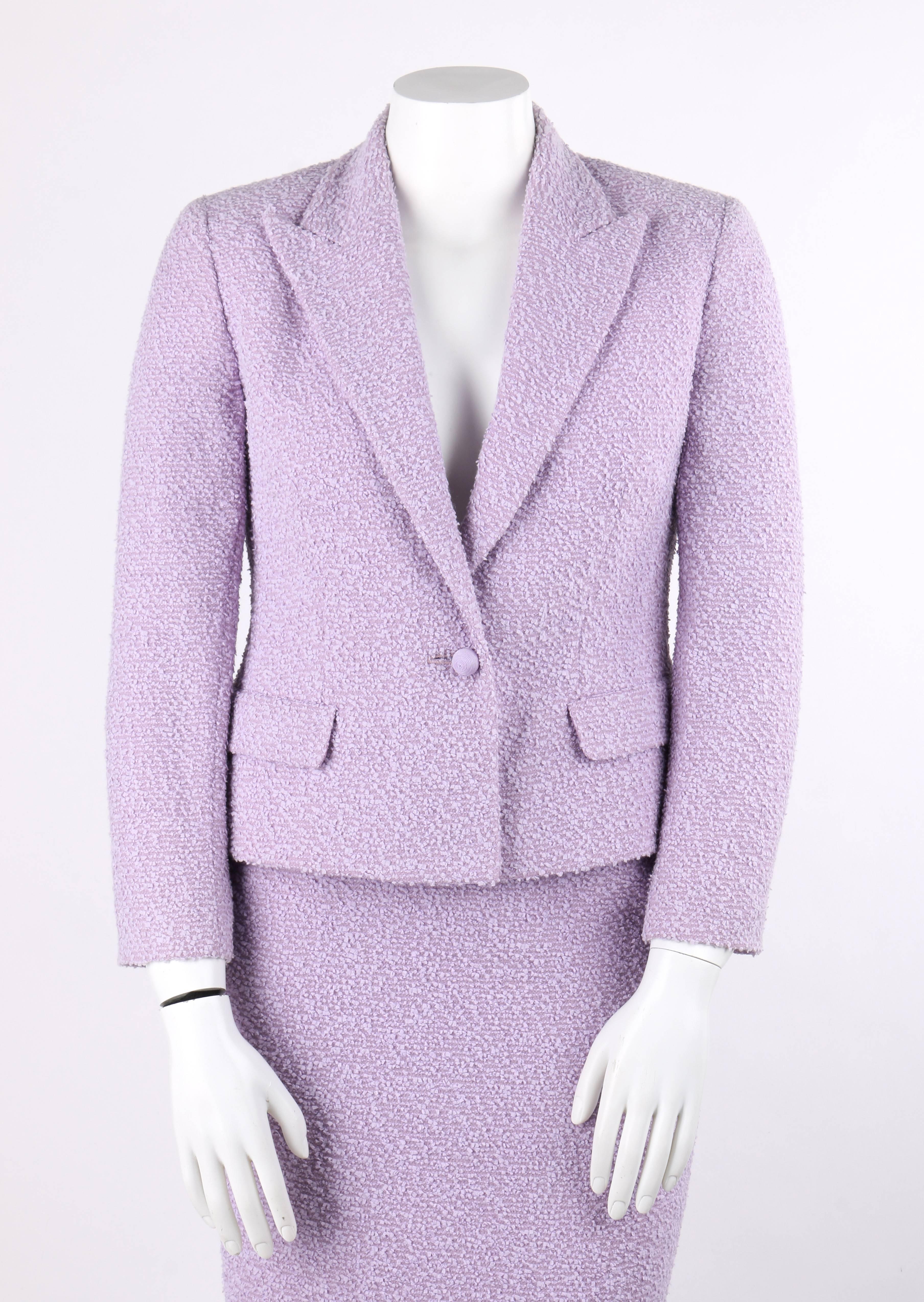 Valentino Miss V c.1990's two piece lavender wool boucle blazer skirt suit set. Designed by Valentino Garavani. Peaked lapel collar blazer. Center front single spherical covered button closure. Long sleeves. Two front hip pockets with flap. Pockets