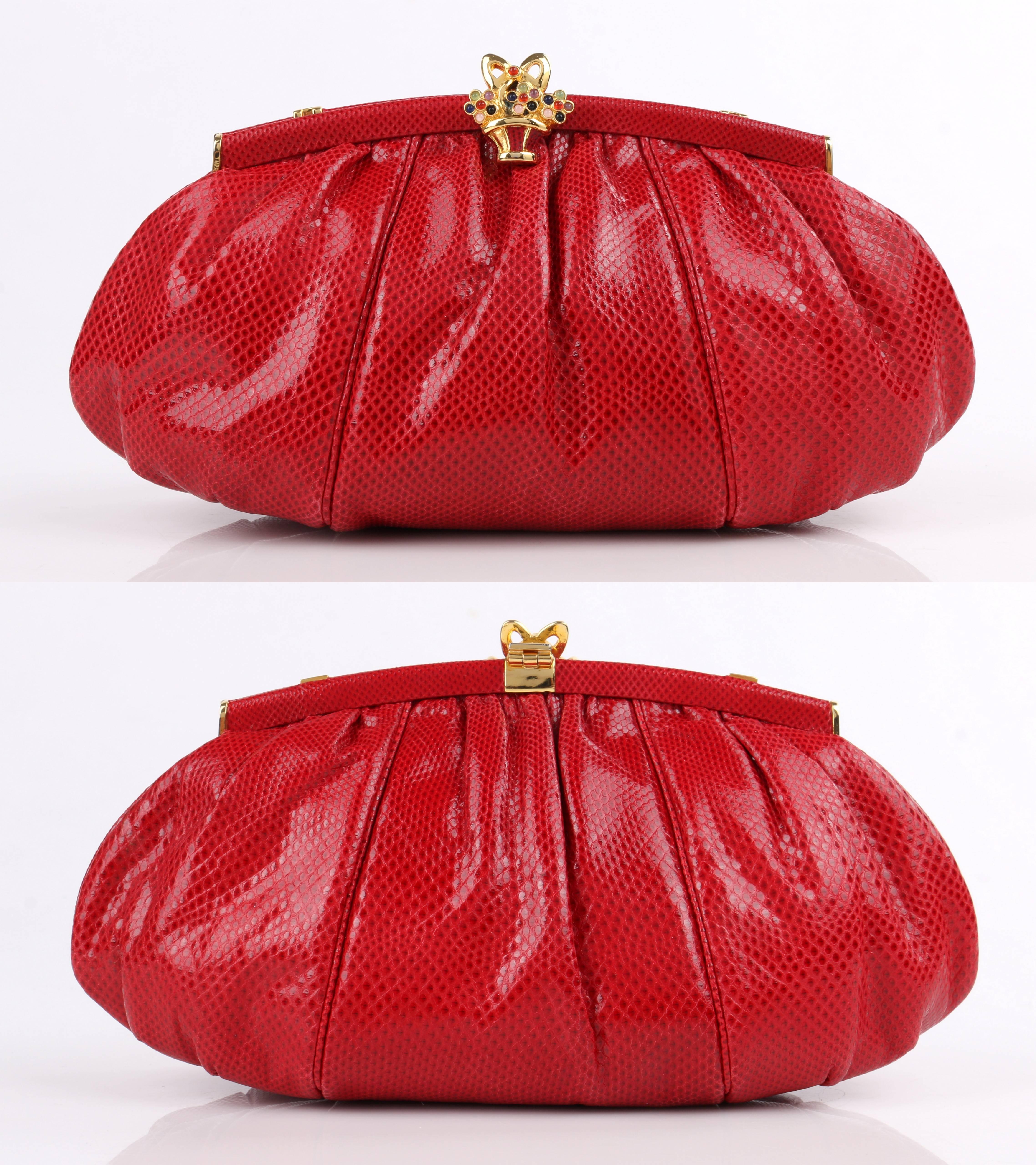 Vintage Judith Leiber c.1980's red lizard skin leather frame top evening bag. Red lizard skin exterior gathered into frame at top with piped detail. Leather covered gold-toned metal arched frame top. Gold-toned metal flower basket and bow hinge top