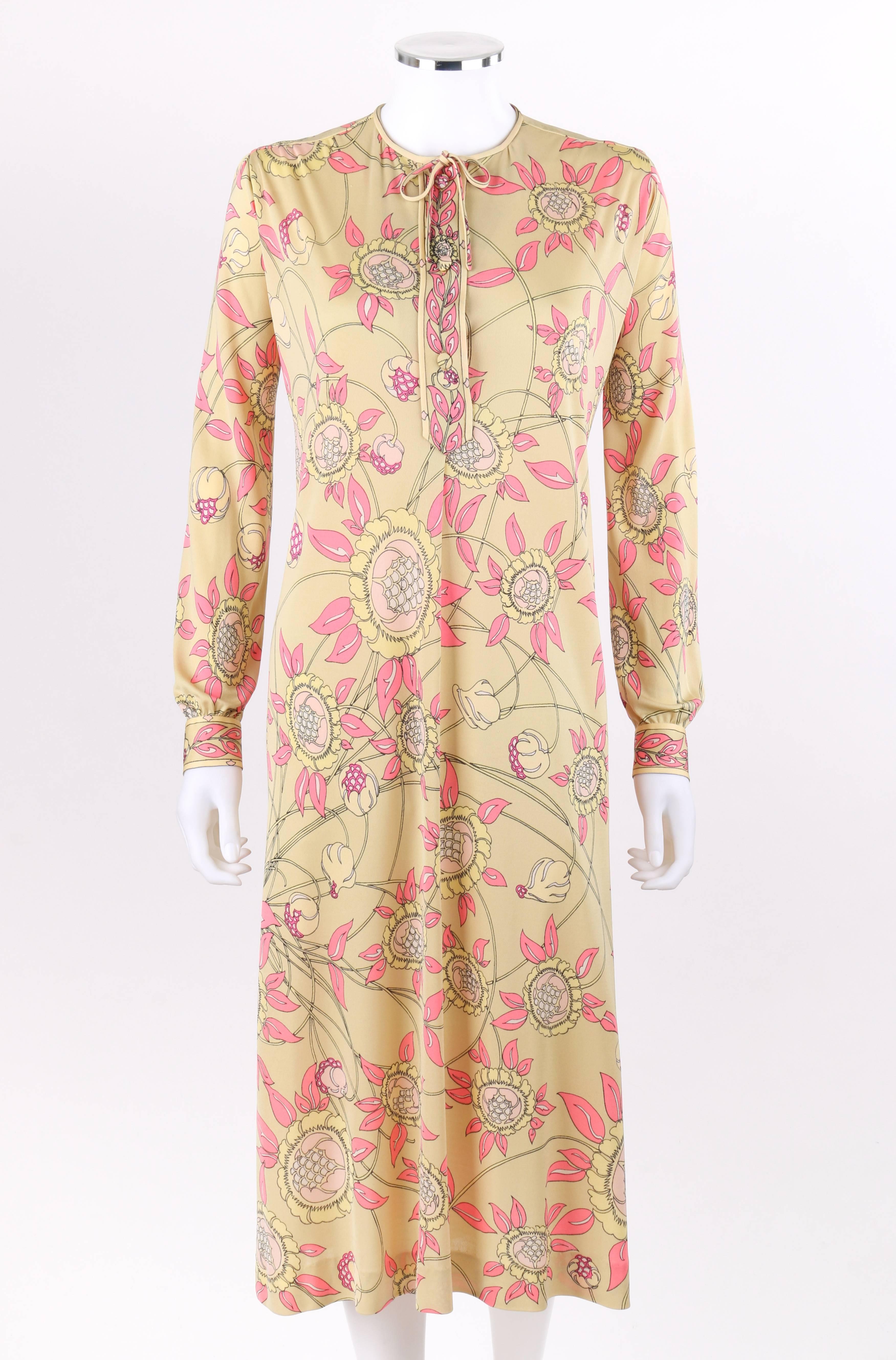 Vintage Emilio Pucci c.1970's floral signature print silk jersey shift dress with belt. Multi-color signature floral print in shades of beige, yellow, pink, and white. Matching floral boarder pint at center front and cuffs. Crew neckline with thin