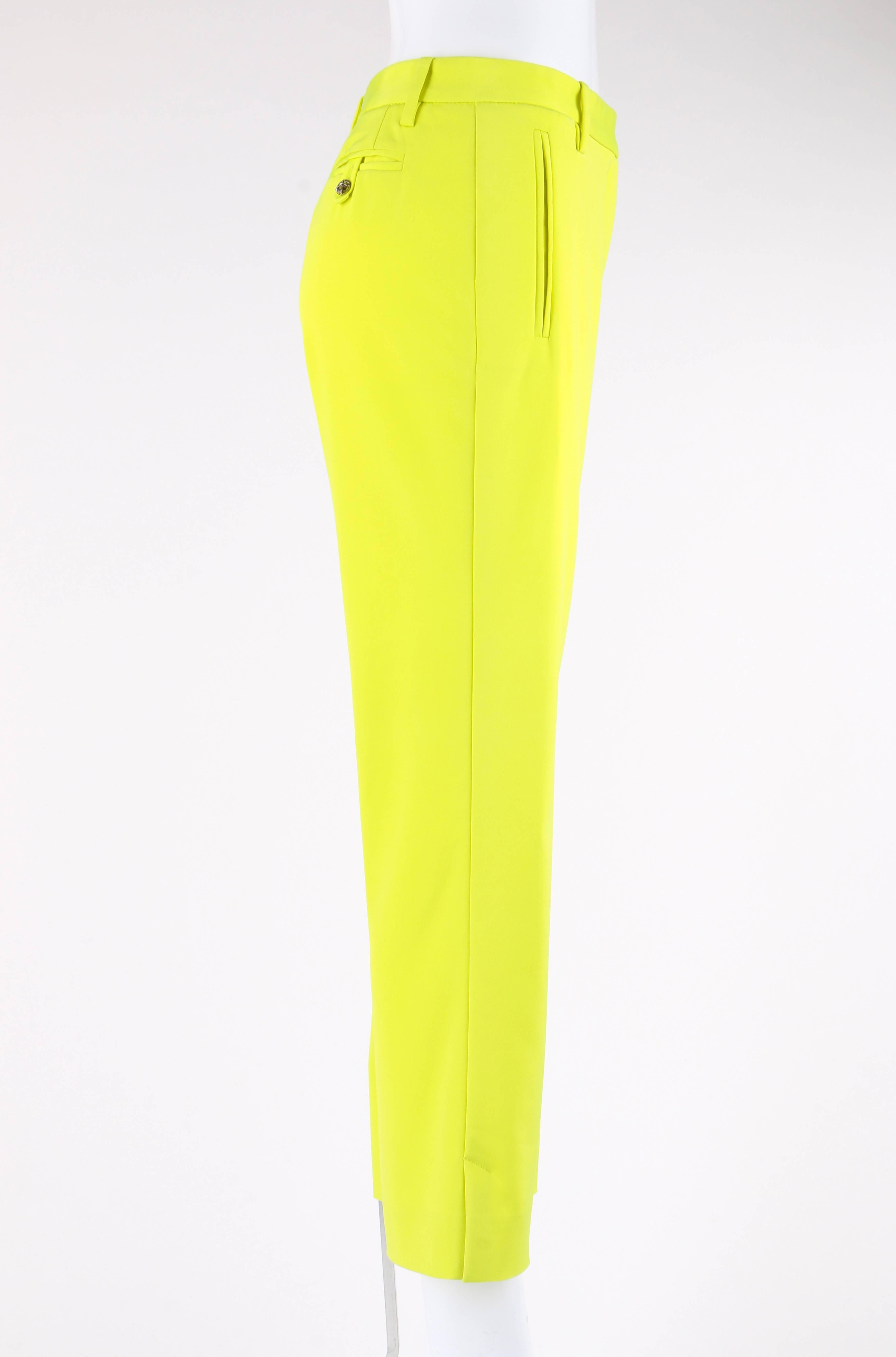 Versace Spring / Summer 2004 neon yellow silk cropped capri pants; New with tags. Runway look #4 designed by Donatella Versace. Thin banded waist. Five belt loops. Center front zip fly with exterior button and tab closure at top. Single interior