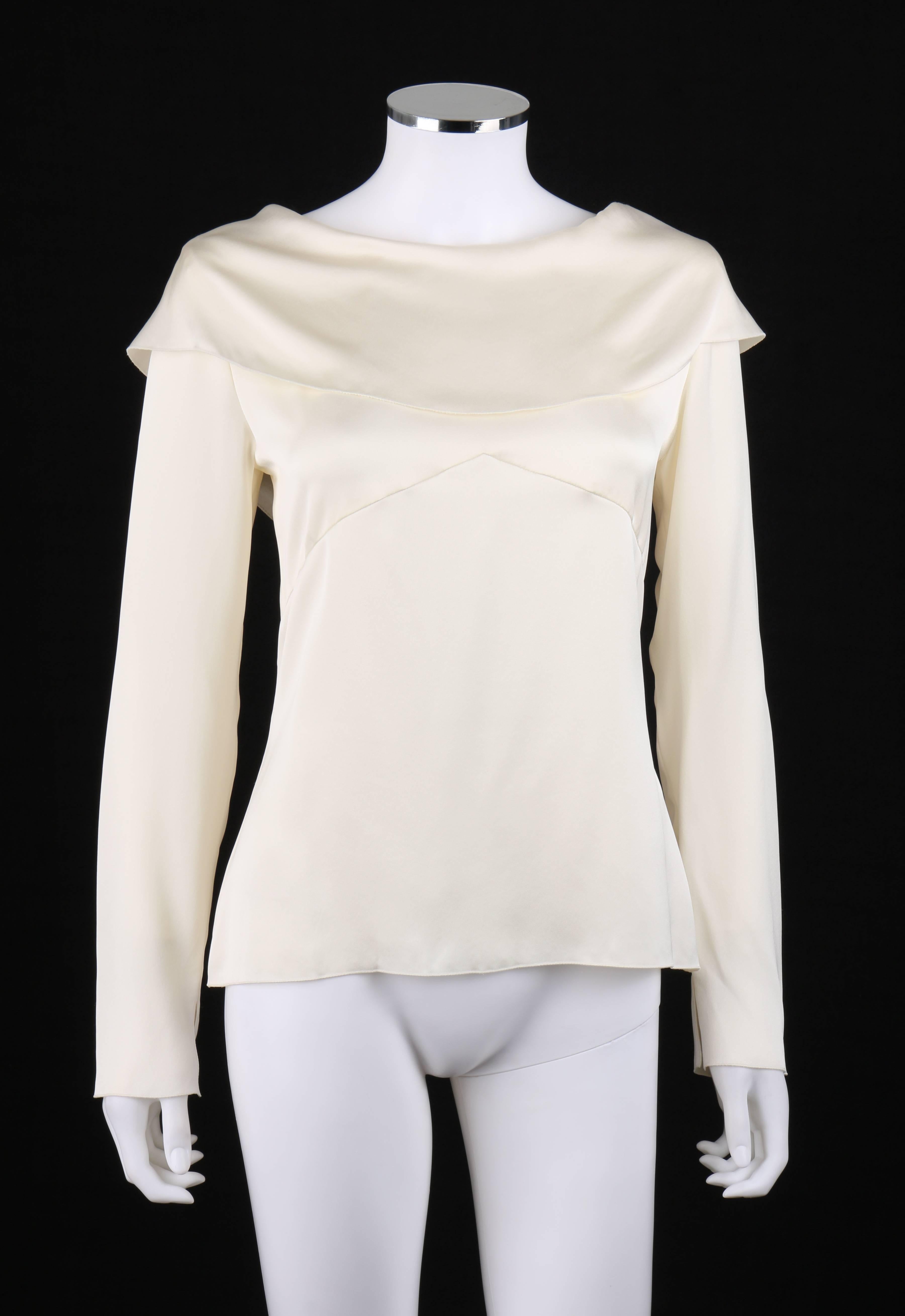Chanel Autumn / Winter 2001 off white silk bertha collar top; New with tags. Designed by Karl Lagerfeld. Long sleeves with slit at cuff. Bertha collar with center back slit. Pointed under bust seam at front. Six center back button closures. Unlined.