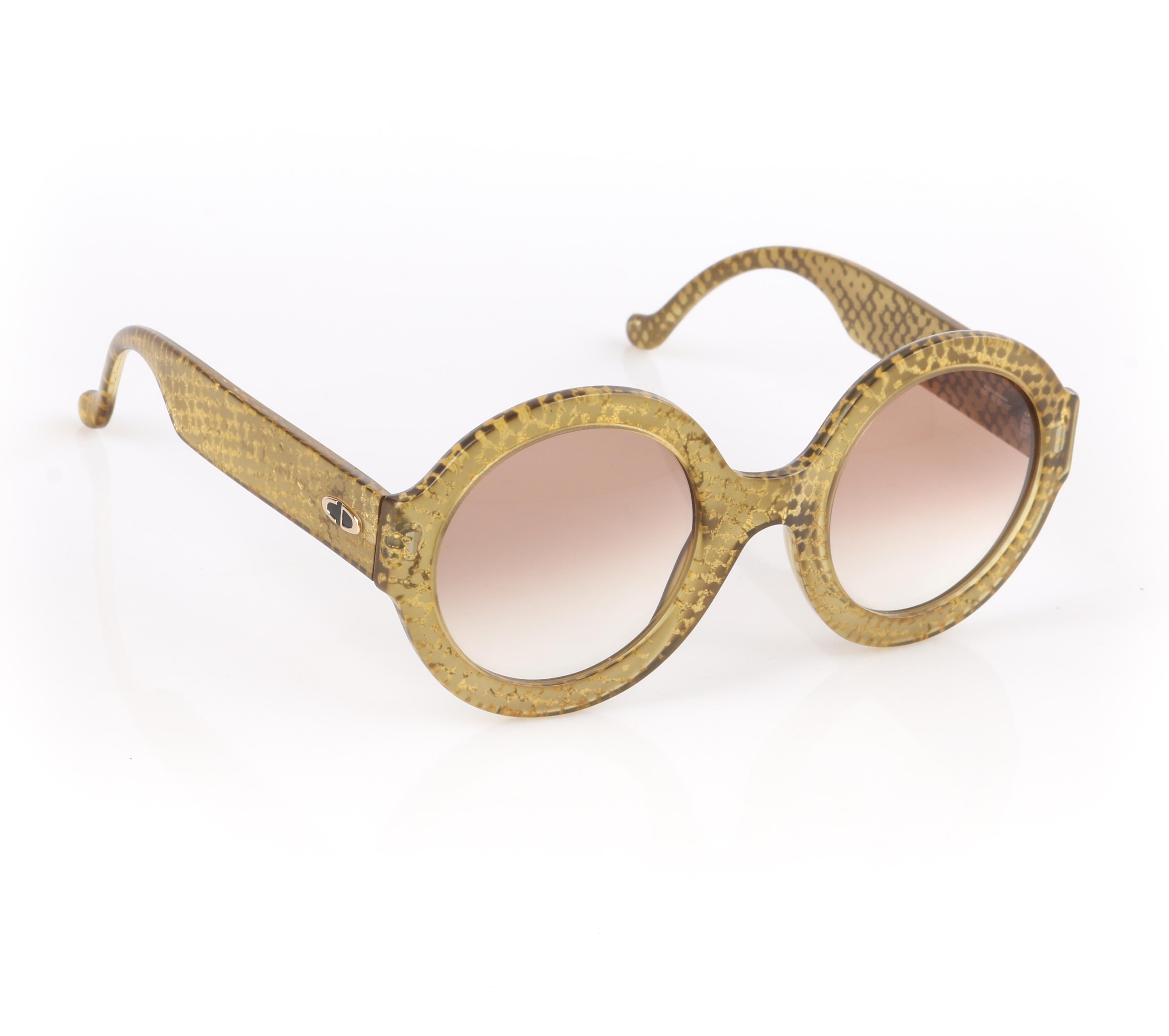 DESCRIPTION: CHRISTIAN DIOR S/S 1992 Translucent Gold Dot Round Optyl Frame Sunglasses 2567
 
Brand / Manufacturer: Christian Dior
Collection: Spring / Summer 1992 Designed by Gianfranco Ferré
Style: Round frame sunglasses
Color(s): Shades of gold,