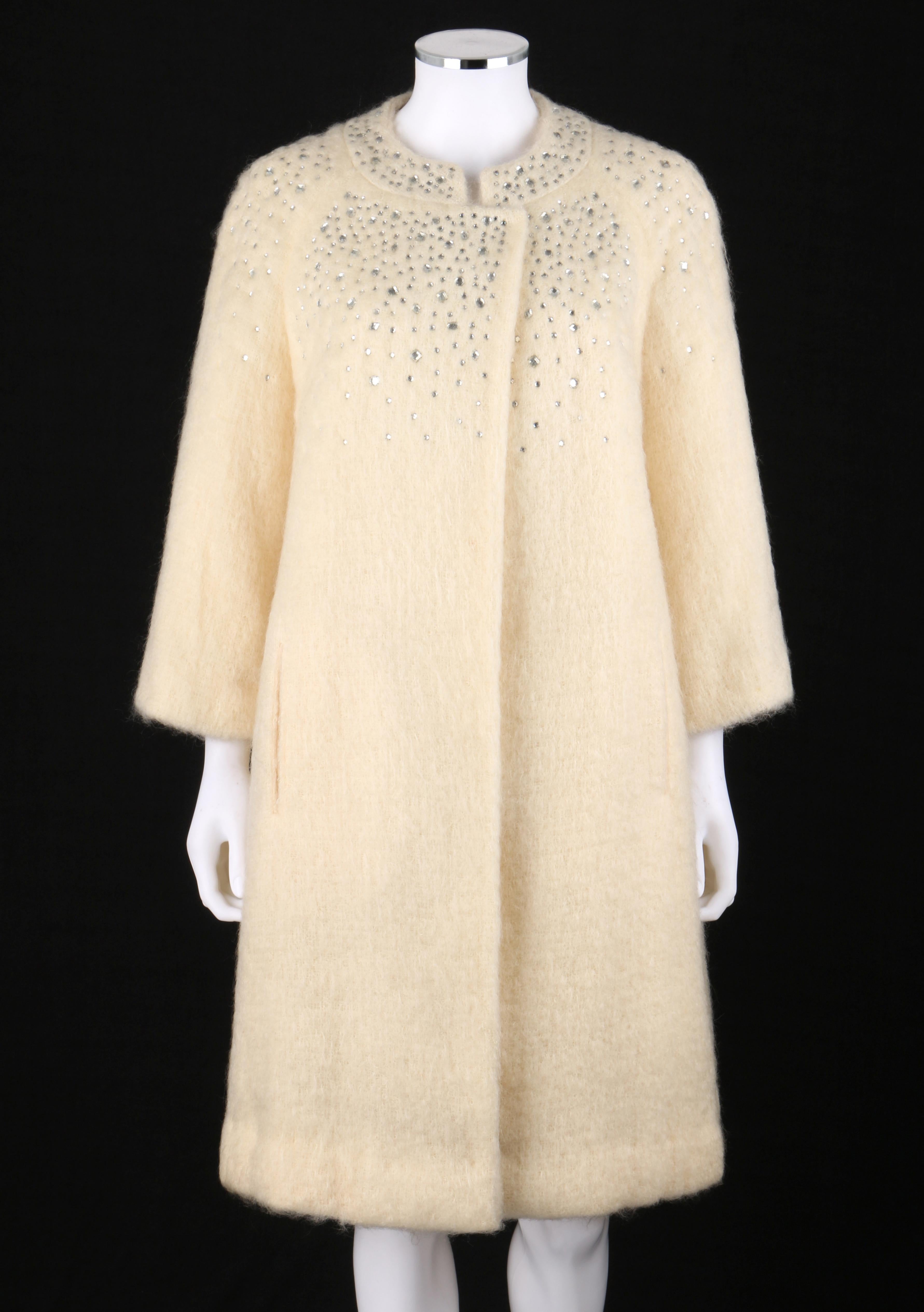 DESCRIPTION: BATALDI c.1960's Ivory Mohair Crystal Rhinestone Embellished Evening Coat
 
Circa: c.1960’s
Label(s): By Baltaldi New York; Union Label
Style: Evening coat
Color(s): Ivory 
Lined: Yes
Unmarked Fabric Content (feel of): Shell: Mohair;