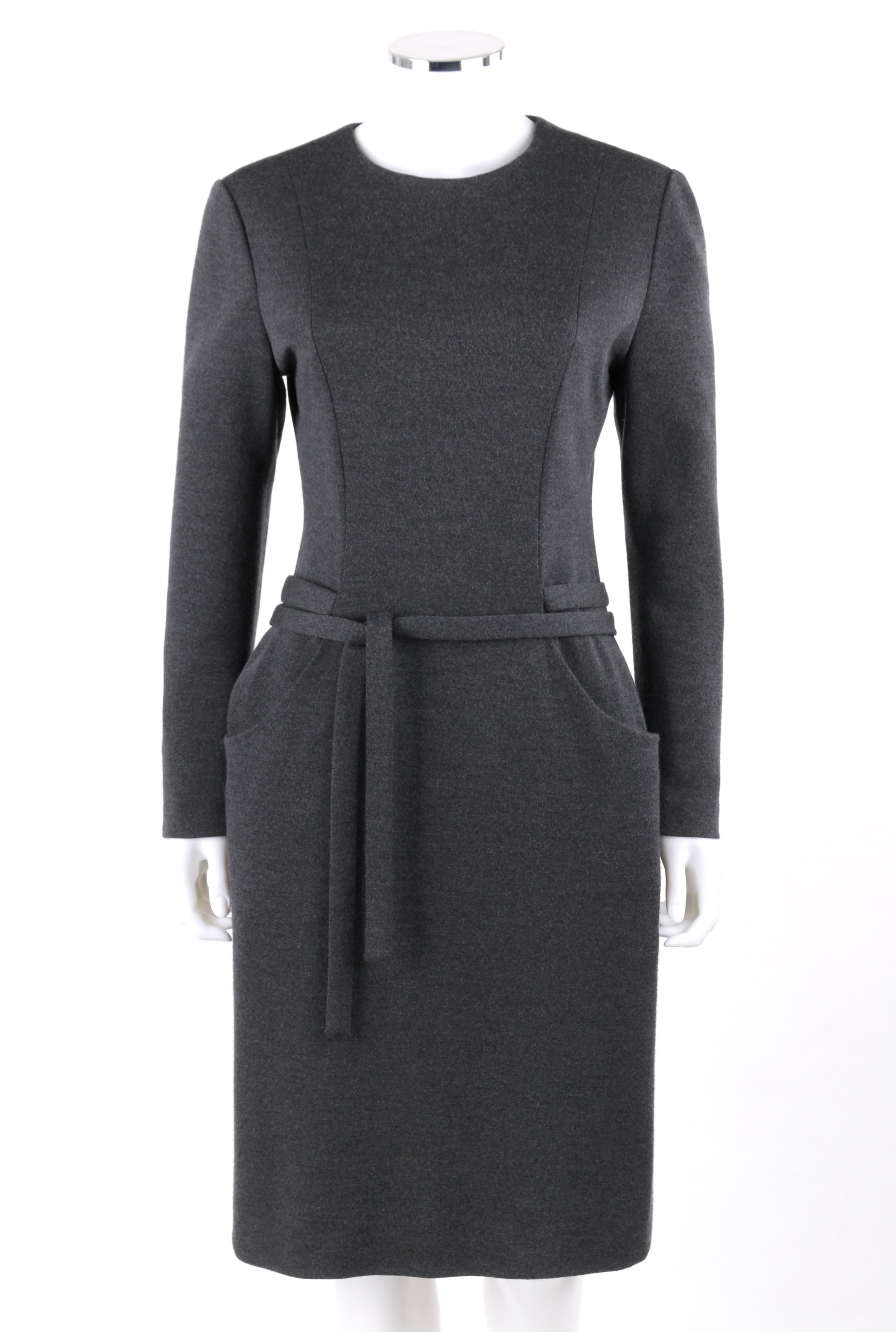 DESCRIPTION: BILL BLASS c.1980's Charcoal Gray Knit Long Sleeve Belted Shift Dress
 
Circa: c.1980’s
Label(s): Bill Blass; Saks Fifth Avenue
Designer: Bill Blass
Style: Shift dress
Color(s): Charcoal gray
Lined: Yes
Unmarked Fabric Content (feel