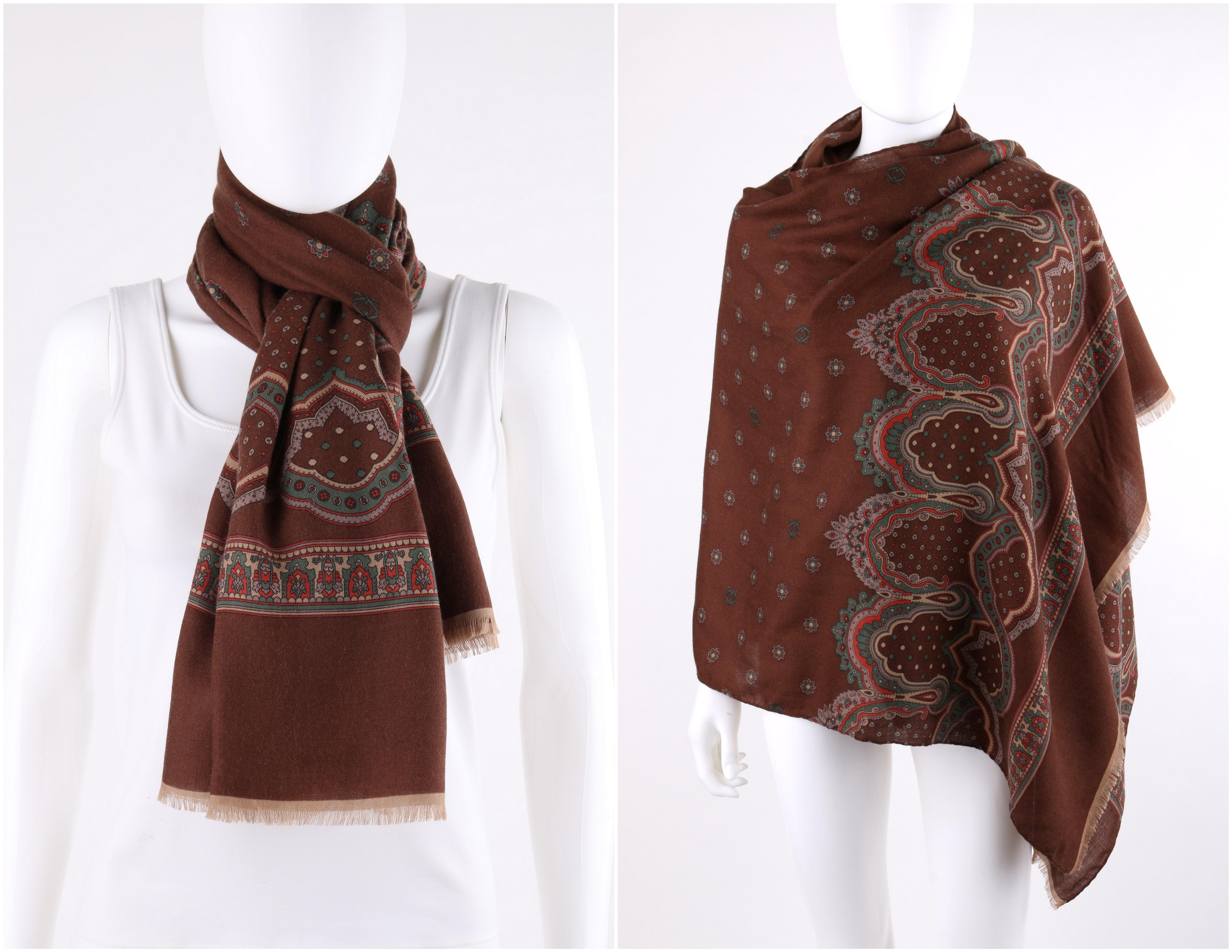DESCRIPTION: LOEWE Brown Wool Silk Floral Paisley Fringe Oblong Scarf / Shawl 
 
Brand / Manufacturer: Loewe
Style: Scarf
Color(s): Shades of brown, green red, and gray
Unmarked Fabric Content (feel of): Wool / Silk blend
Additional Details /