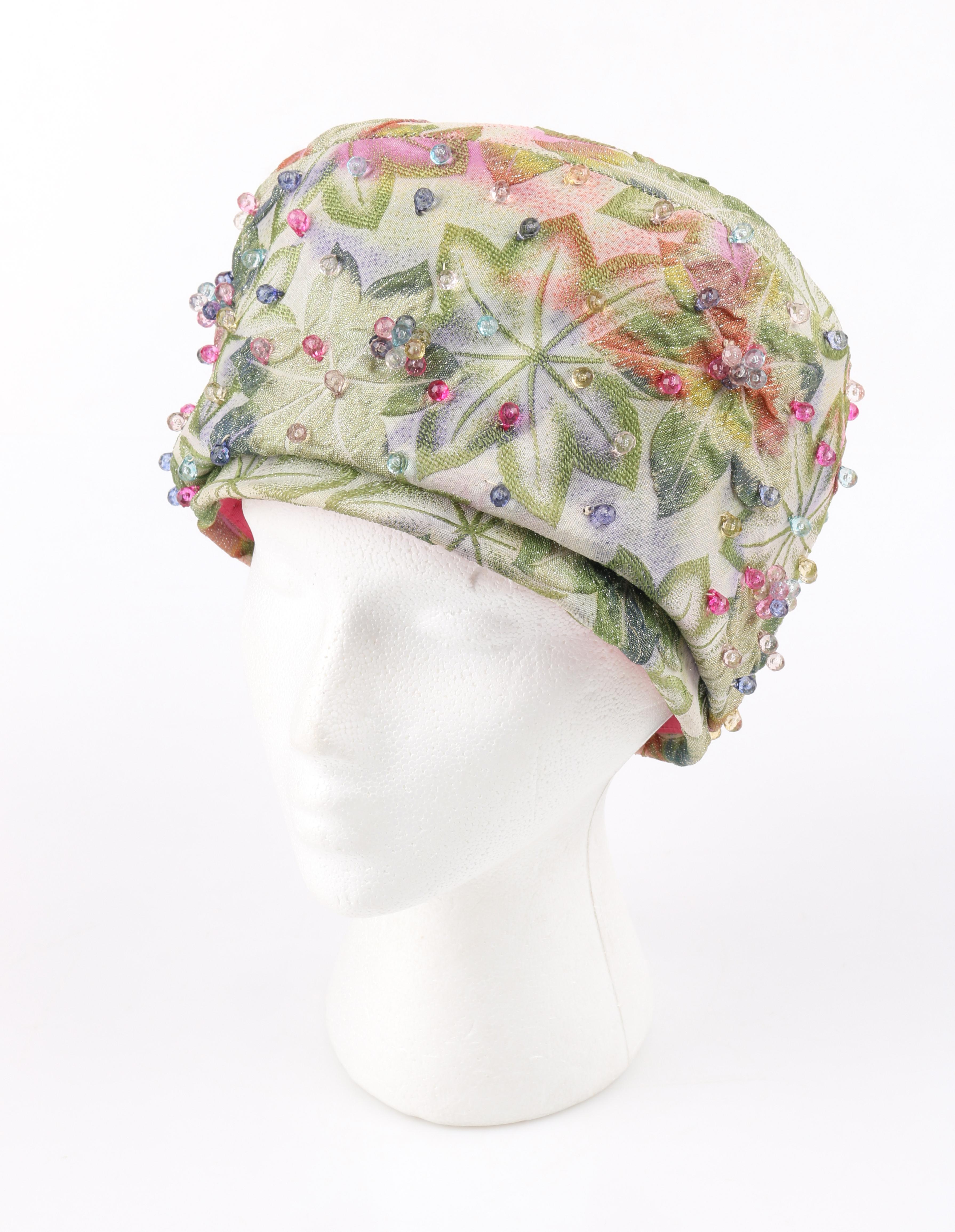 DESCRIPTION: CHRISTIAN DIOR Chapeaux c.1960's Soft Green Leaf Jacquard Beaded Peach Basket Pillbox Hat
 
Circa: c.1960’s
Label(s): Christian Dior Chapeaux Paris - New York; United Hatters, Cap, and Millinery Workers union label
Style: hybrid of a