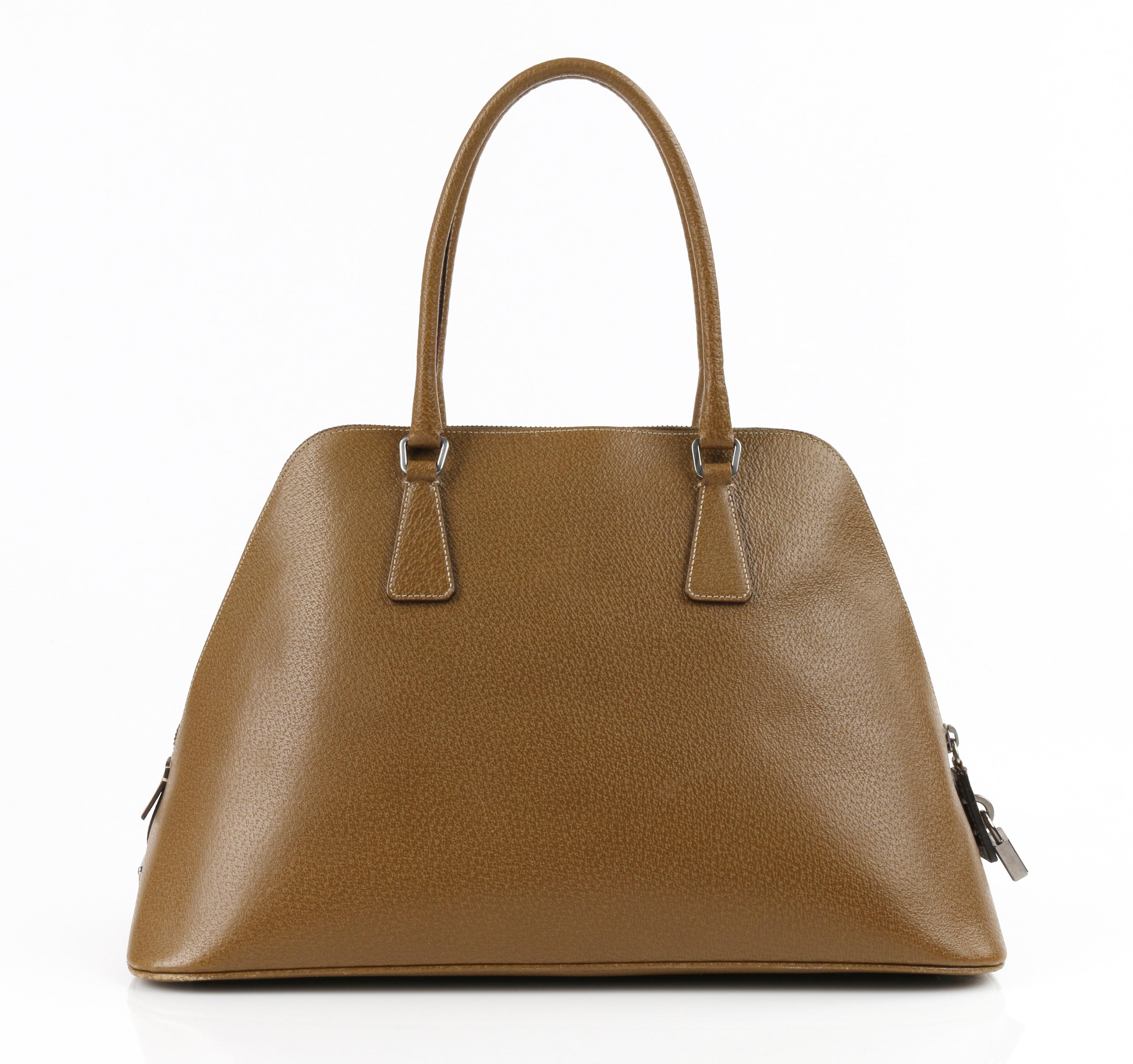 PRADA Olive Brown Leather Structured Top Handle Trapezoid Satchel Purse
 
Brand / Manufacturer: Prada
Style: Trapezoid satchel
Color(s): Olive brown
Lined: Yes
Unmarked Fabric Content (feel of): Leather
Additional Details / Inclusions: Olive brown