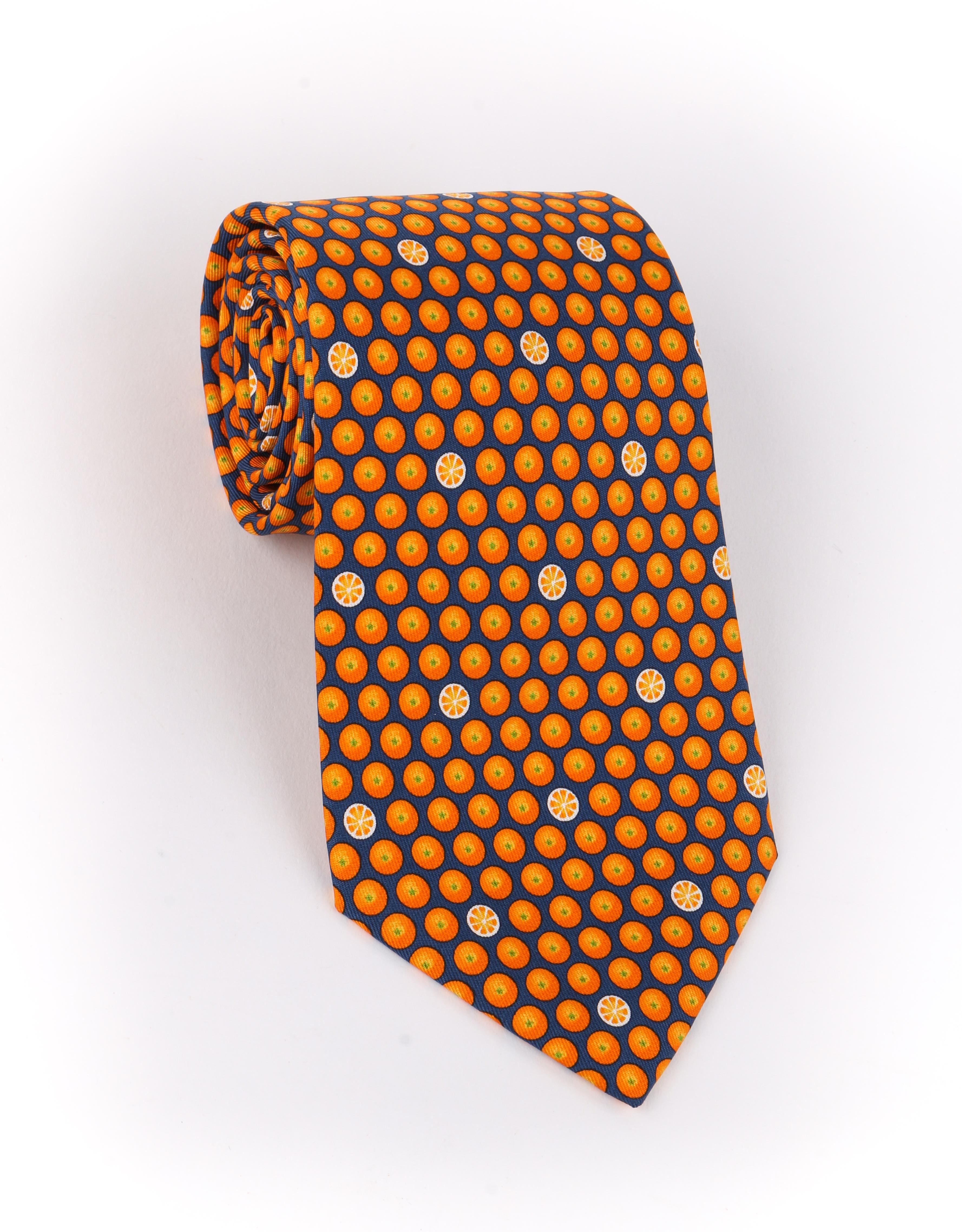 DESCRIPTION: HERMES Navy Blue & Orange Fruit Polka Dot Print 5 Fold Silk Necktie Tie 5300 TA
 
Brand / Manufacturer: Hermes
Collection: 
Designer: 
Manufacturer Style Name: 
Style: 5 fold necktie
Color(s): Multi in shades of navy blue, orange, and