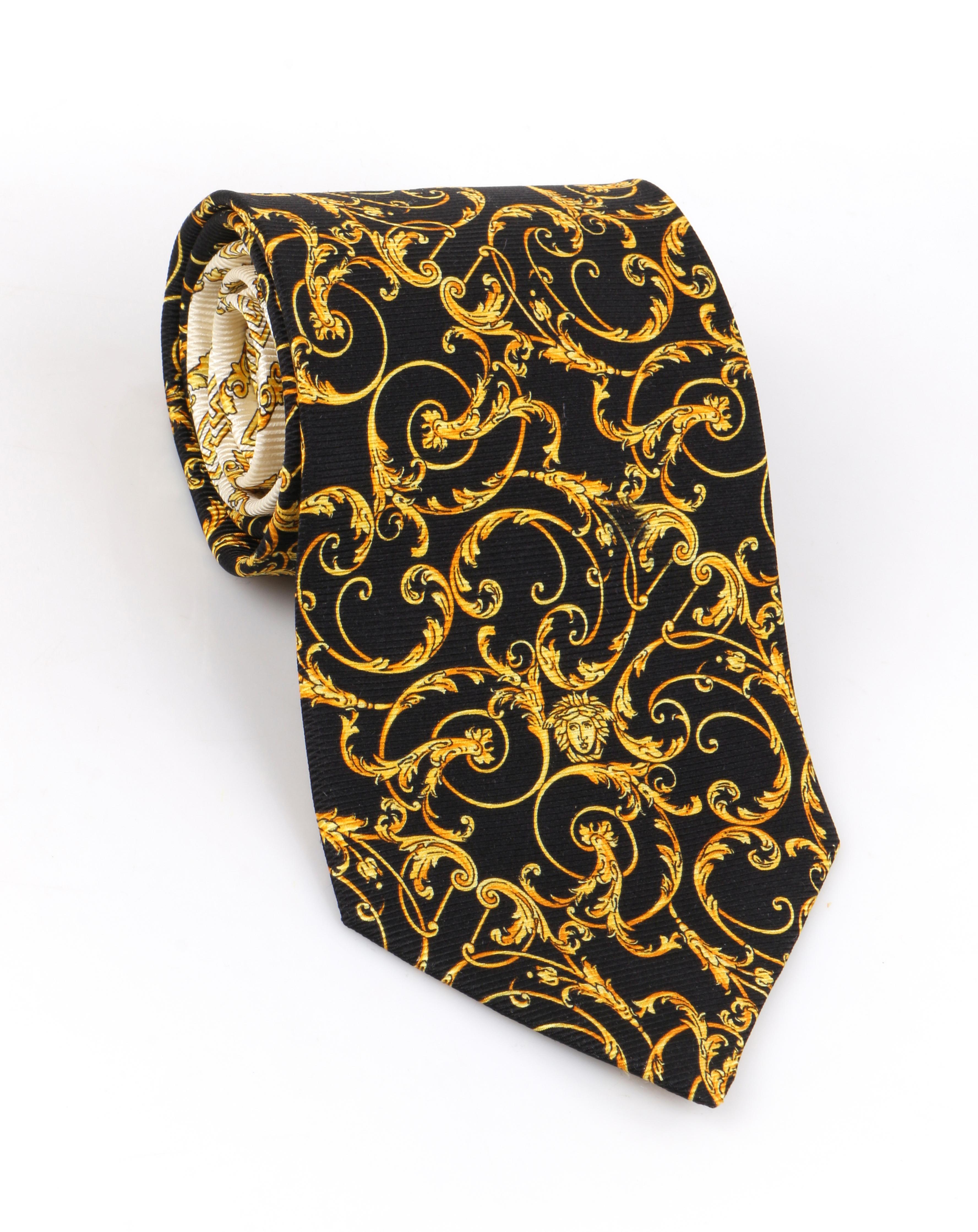 DESCRIPTION: GIANNI VERSACE c.1990's Baroque Medusa Head Print Silk Necktie Tie
 
Circa: c.1990’s
Label(s): Gianni Versace
Style: Necktie
Designer: 
Color(s): Shades of black, cream, and gold
Lined: Yes
Marked Fabric Content: 100% Silk
Unmarked