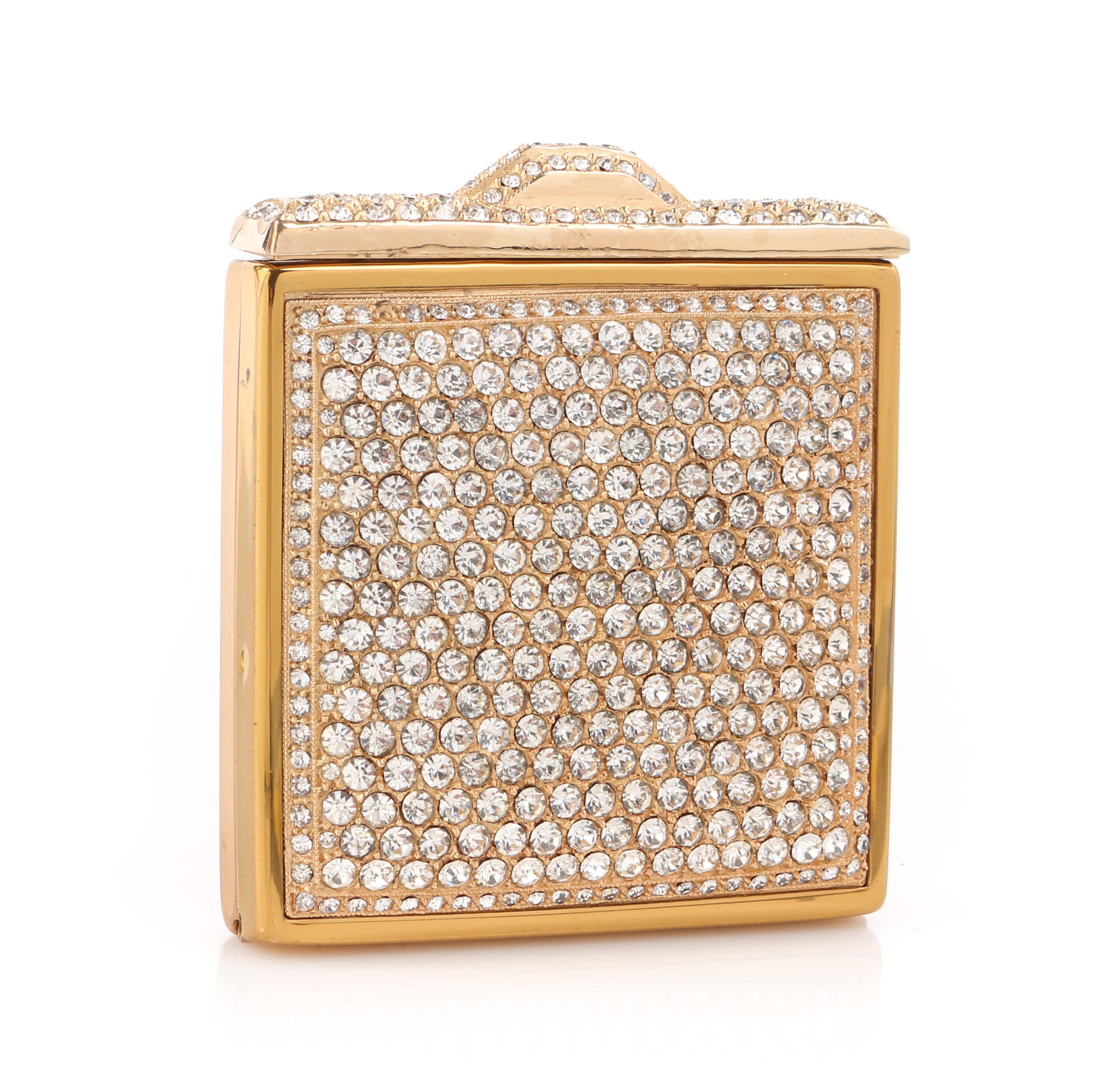DESCRIPTION: c.1930's Crystal Rhinestone Embellished Brass Square Mirror Compact
 
Circa: c.1930’s
Style: Compact
Color(s): Brass
Unmarked Material (feel of): Brass-toned hardware; Rhinestones
Additional Details / Inclusions: Pave set crystal