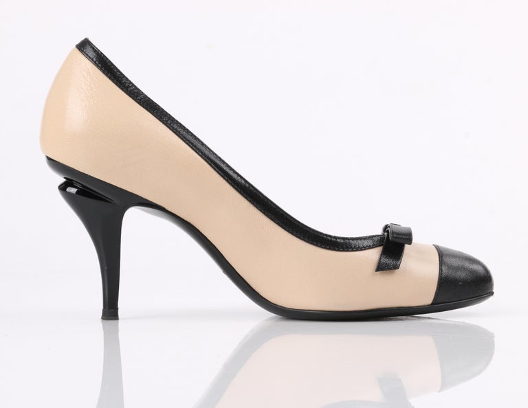 CHANEL Nude and Black Leather Classic Bow Cap Toe Sculptural Heel Pumps at  1stDibs