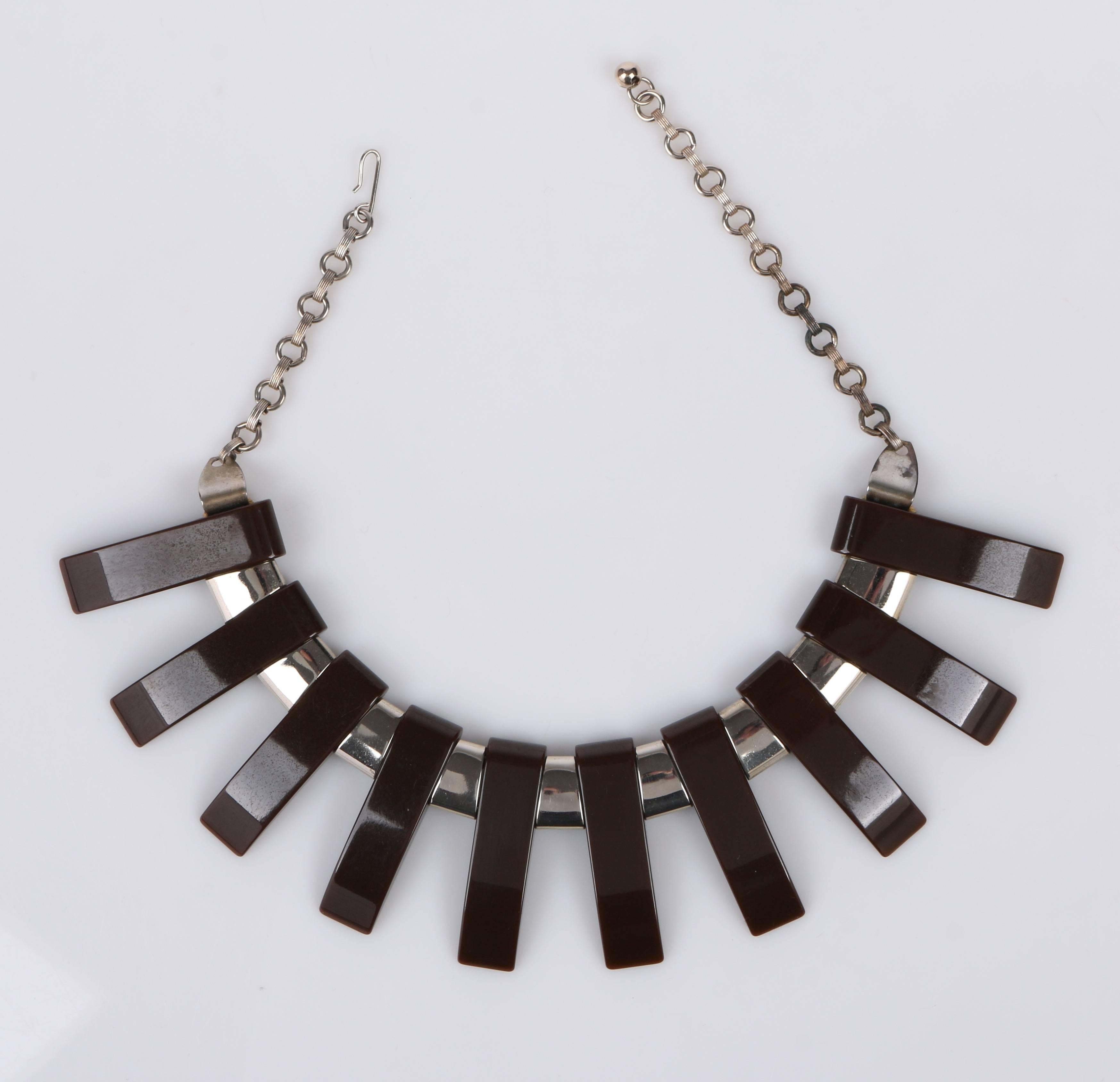 Vintage 1930's Art Deco large chrome and dark brown Bakelite/vintage plastic bib necklace is featured in Roseann Ettinger's Popular Jewelry 1840-1940, 2nd edition, page 146, and on back cover.  This chrome and dark brown bakelite geometric fringed