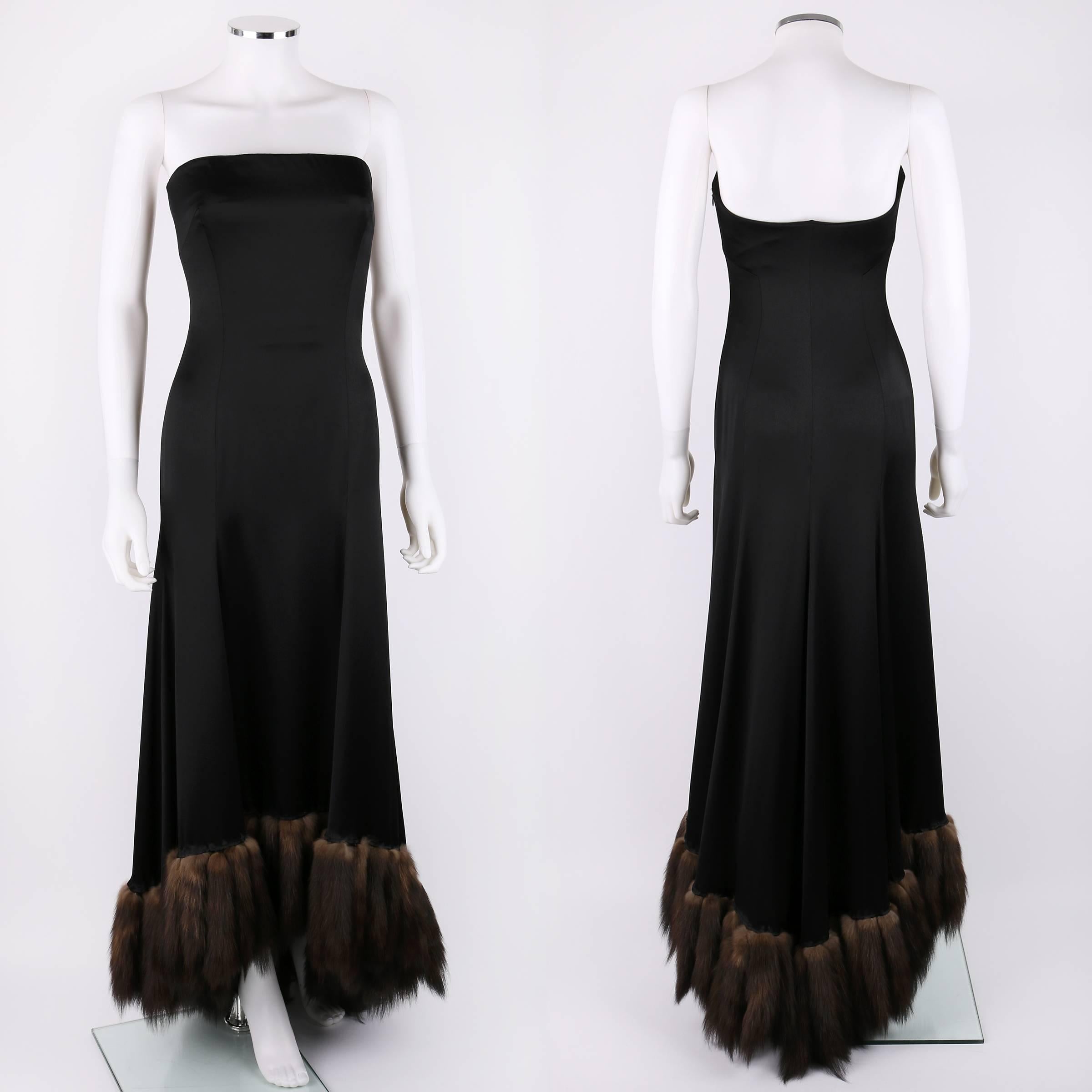 J Mendel Paris black satin strapless evening gown. Hi-lo hemline is trimmed with genuine sable fur. Interior boned bustier has separate zip closure. Zips at side. There is no fabric content label, but this dress is crafted of a silk / satin with